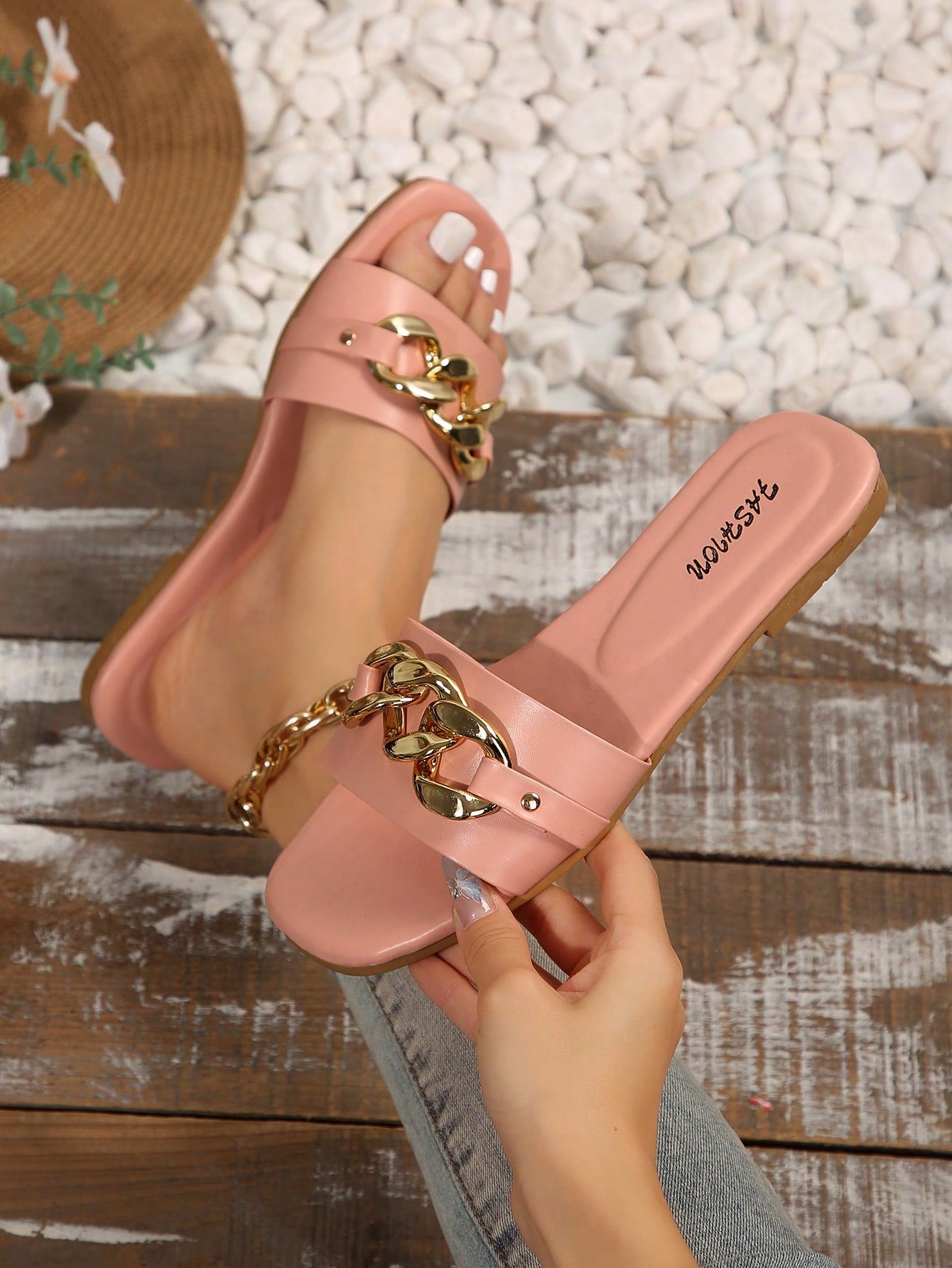 Women's gold-tone slip-on slide sandals with open toe and chain link detailing, shown as casual flat sandals for indoor and outdoor use.