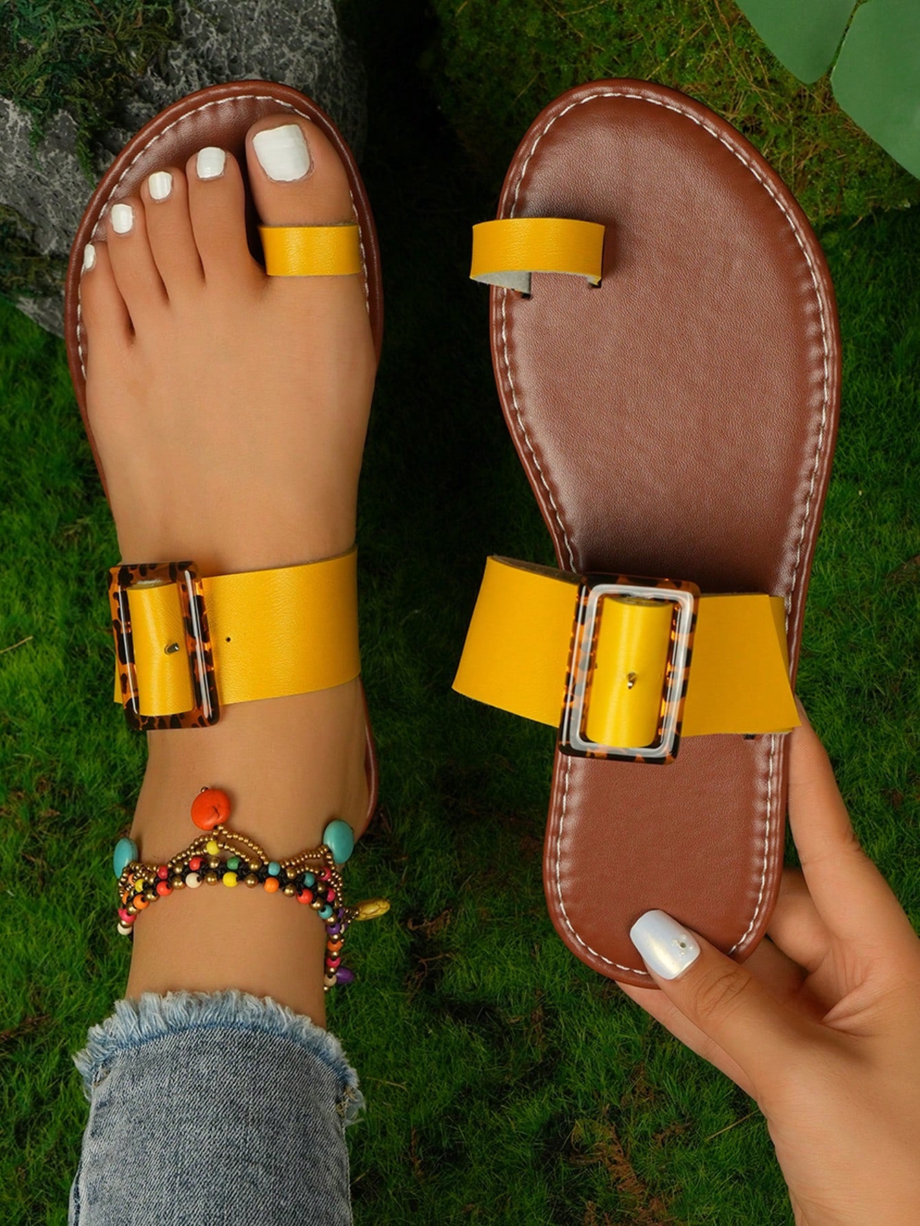 Women's flat slide sandals with leopard print styling, antique-style square buckle detail, and toe post design.