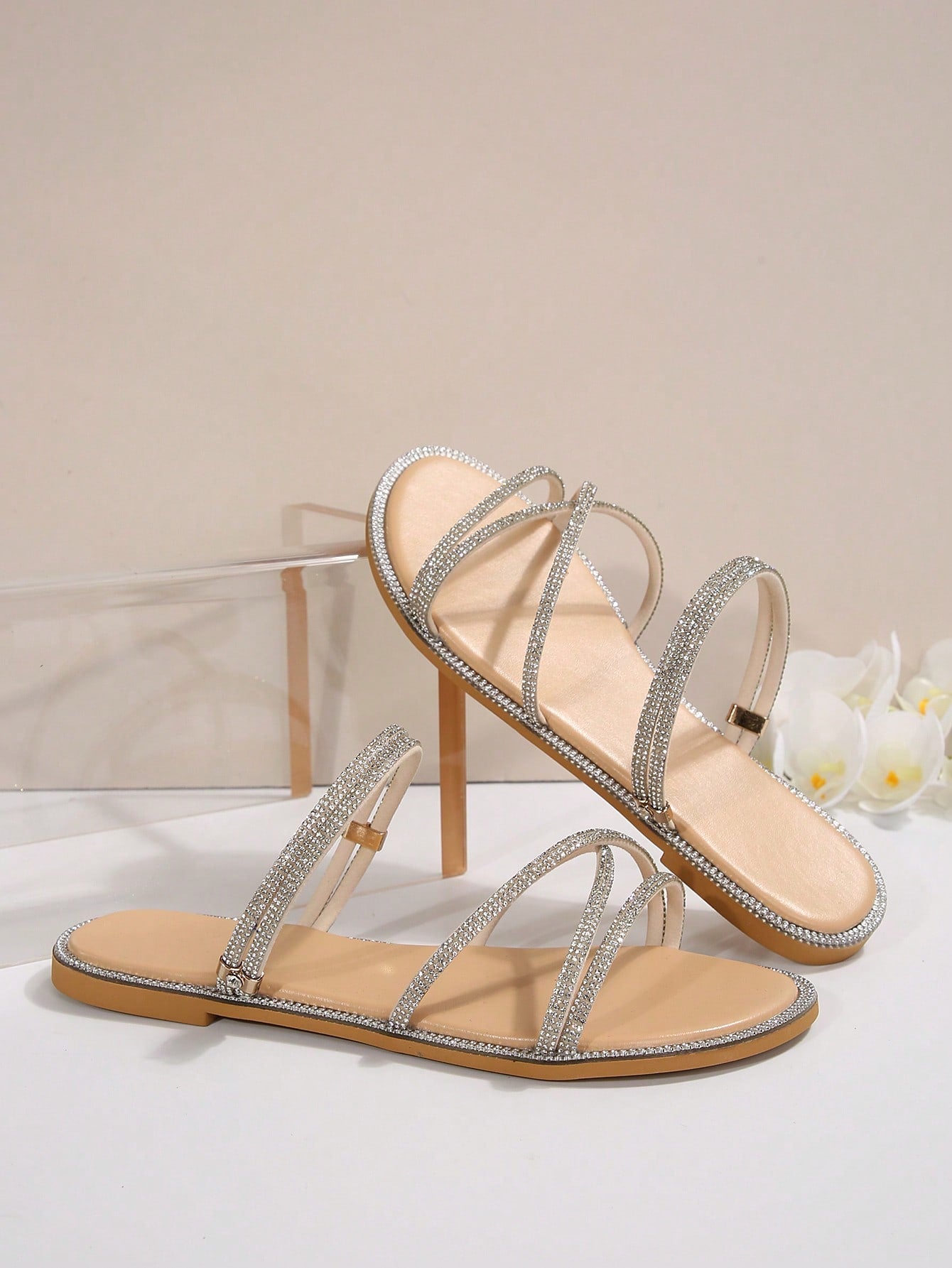 Women's flat open-toe sandals featuring braided multi-strap detailing in a solid color, designed for everyday wear, beach outings, parties, and summer events.
