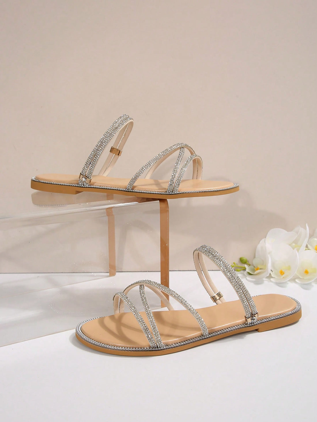 Women's flat open-toe sandals featuring braided multi-strap detailing in a solid color, designed for everyday wear, beach outings, parties, and summer events.