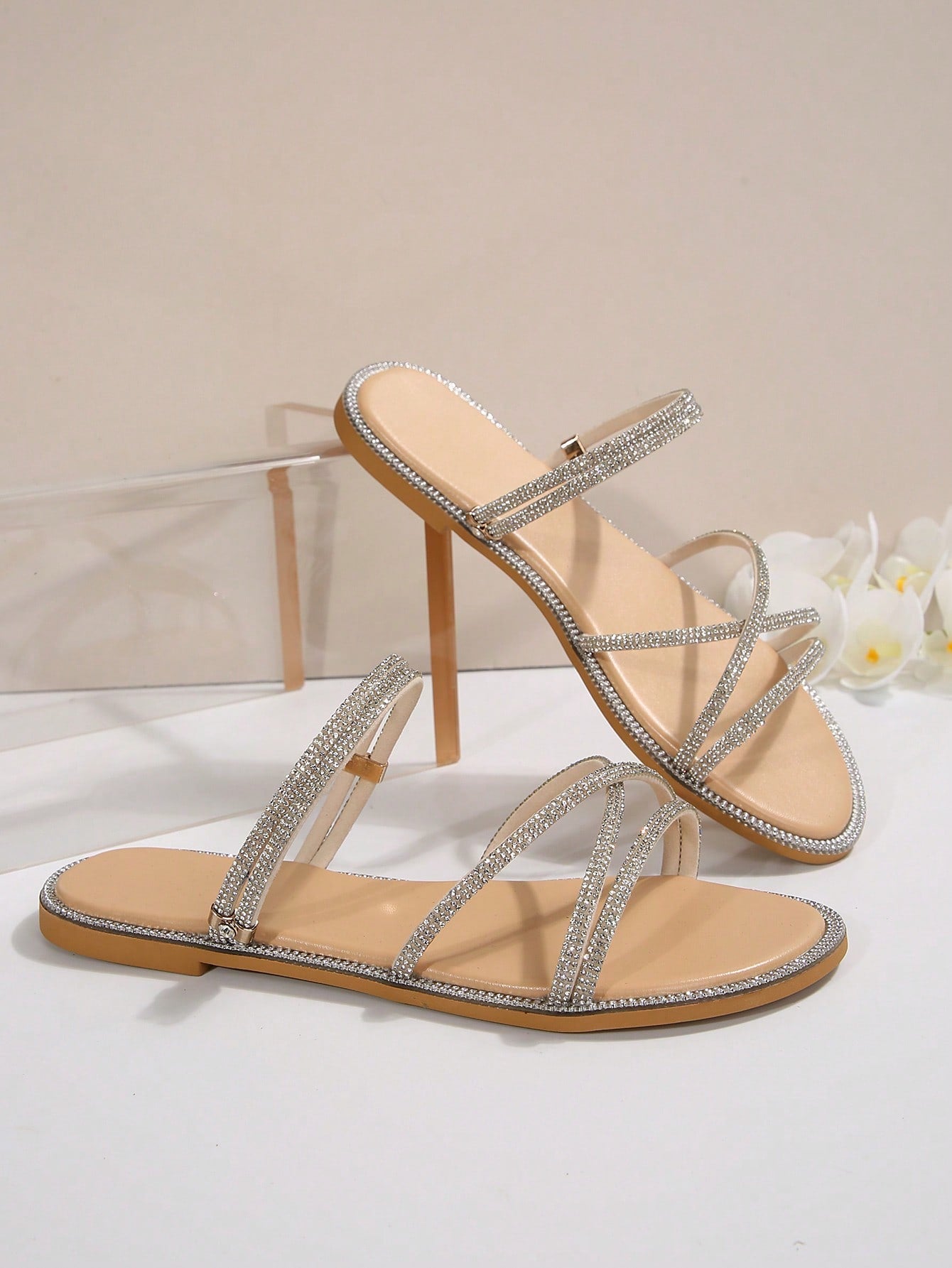 Women's flat open-toe sandals featuring braided multi-strap detailing in a solid color, designed for everyday wear, beach outings, parties, and summer events.
