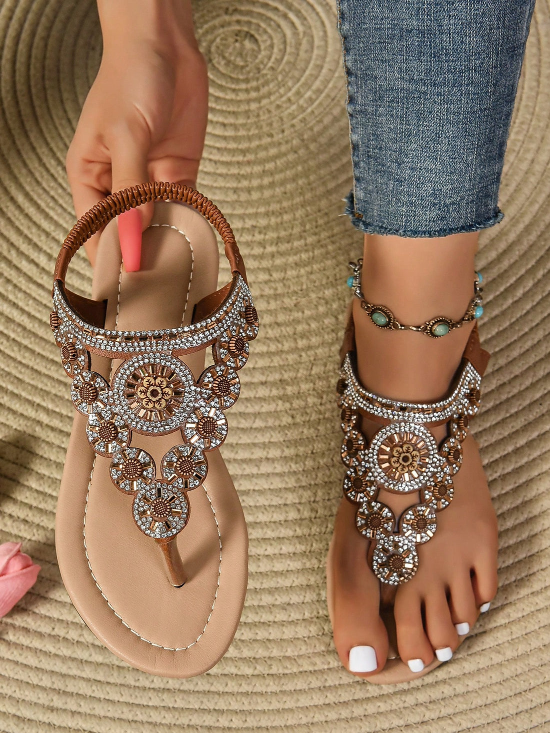 Women's brown flat Roman sandals with rhinestone detailing and sequin upper, outdoor slip-on style with rubber sole.