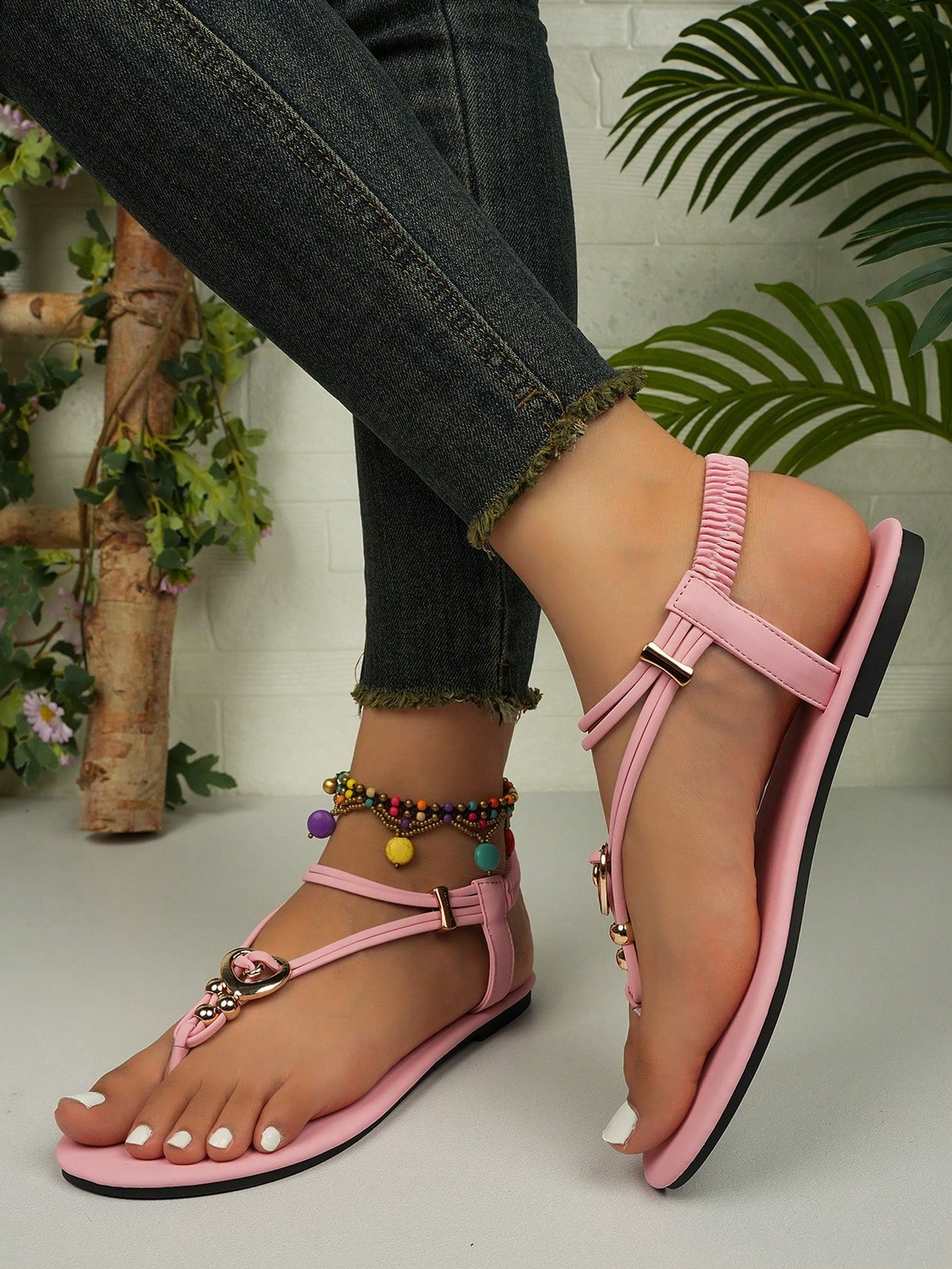 Women's slip-on flat gladiator sandals with beaded detail and toe post design