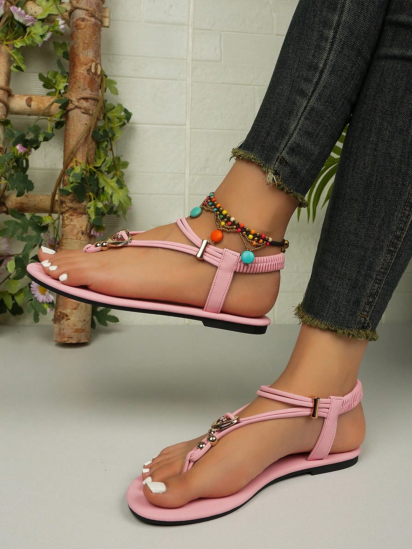Women's slip-on flat gladiator sandals with beaded detail and toe post design