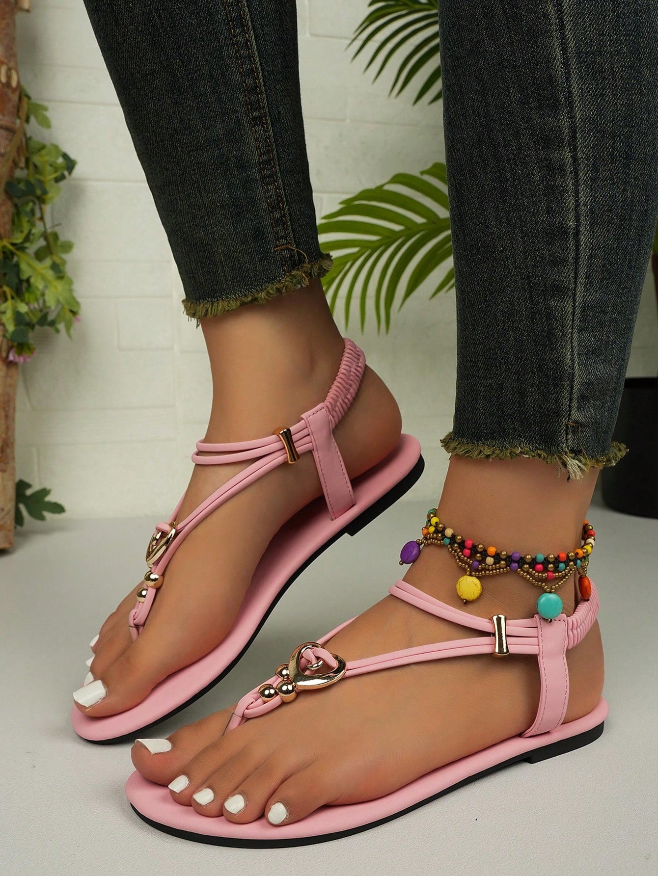 Women's slip-on flat gladiator sandals with beaded detail and toe post design