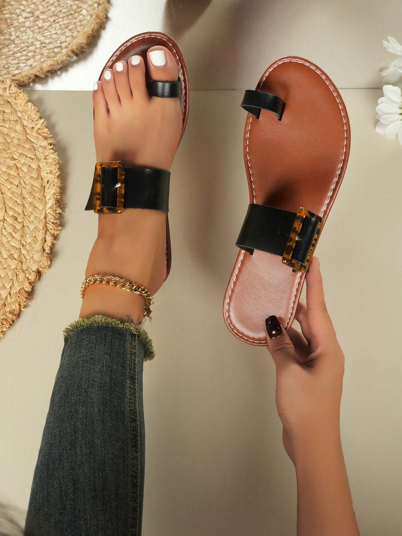 Women's flat slide sandals with leopard print styling, antique-style square buckle detail, and toe post design.