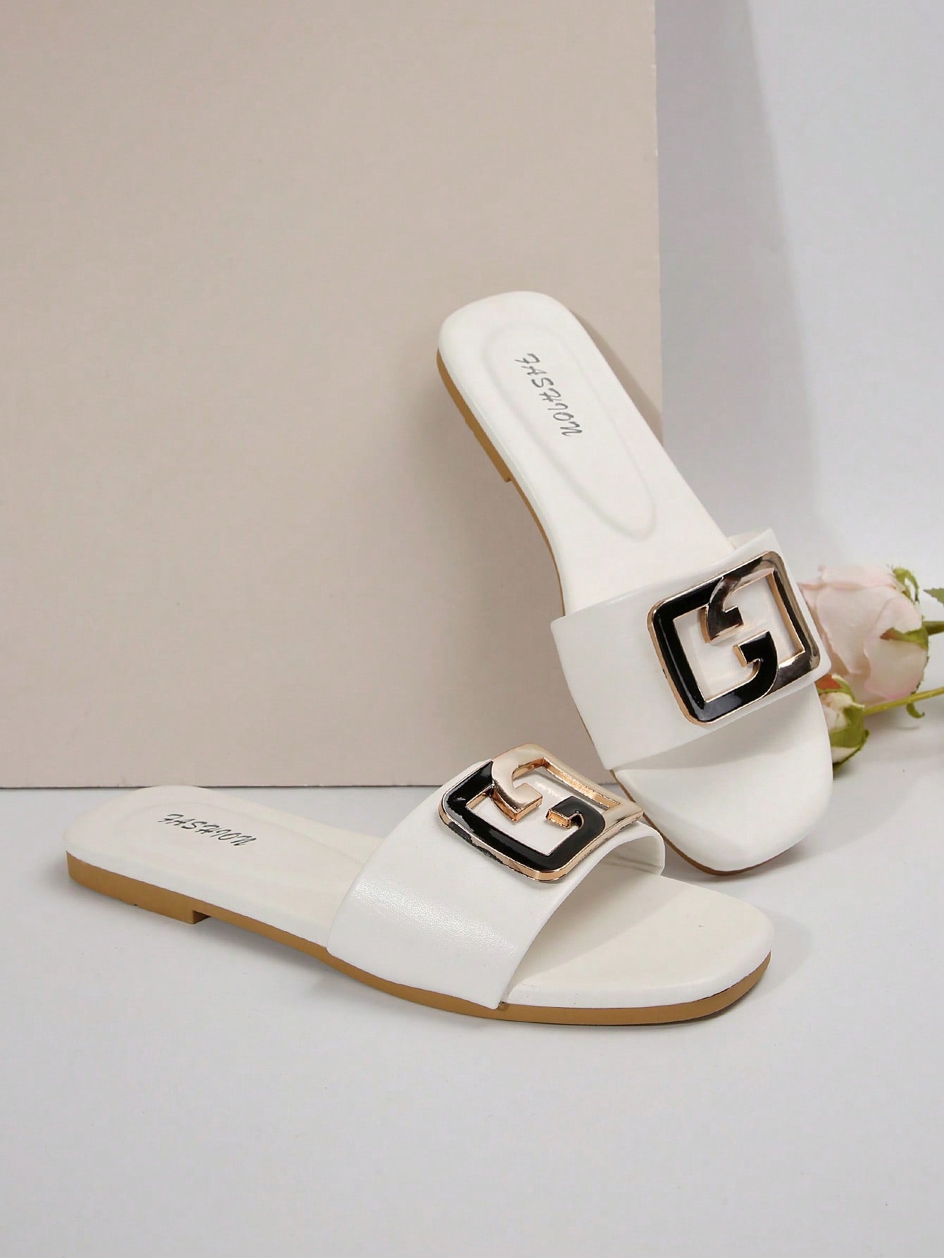 Women's gold-tone slip-on slide sandals with open toe and chain link detailing, shown as casual flat sandals for indoor and outdoor use.