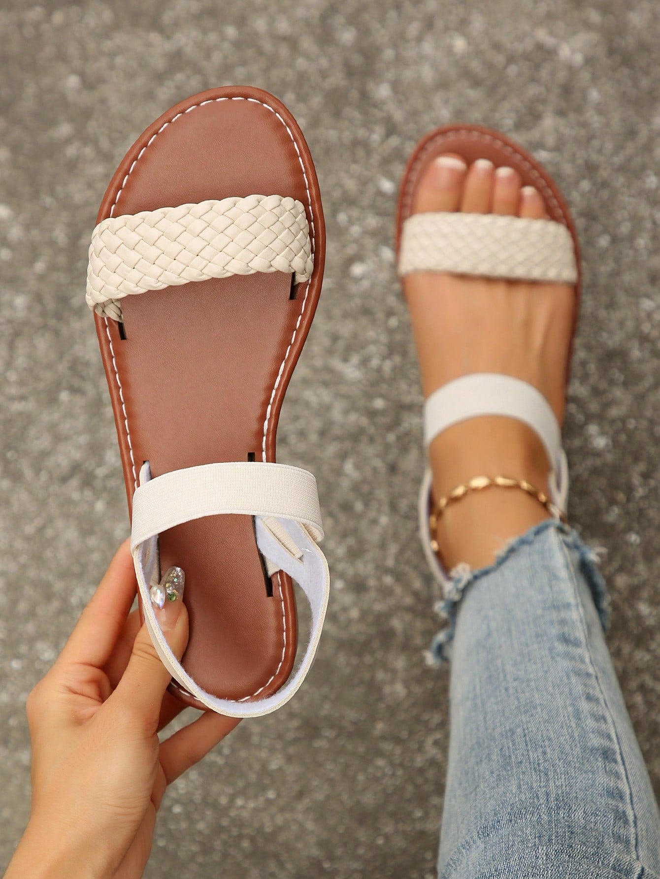 Women’s flat slide sandals with cut-out Roman-style straps and open-toe design, suitable for casual beach and home wear.