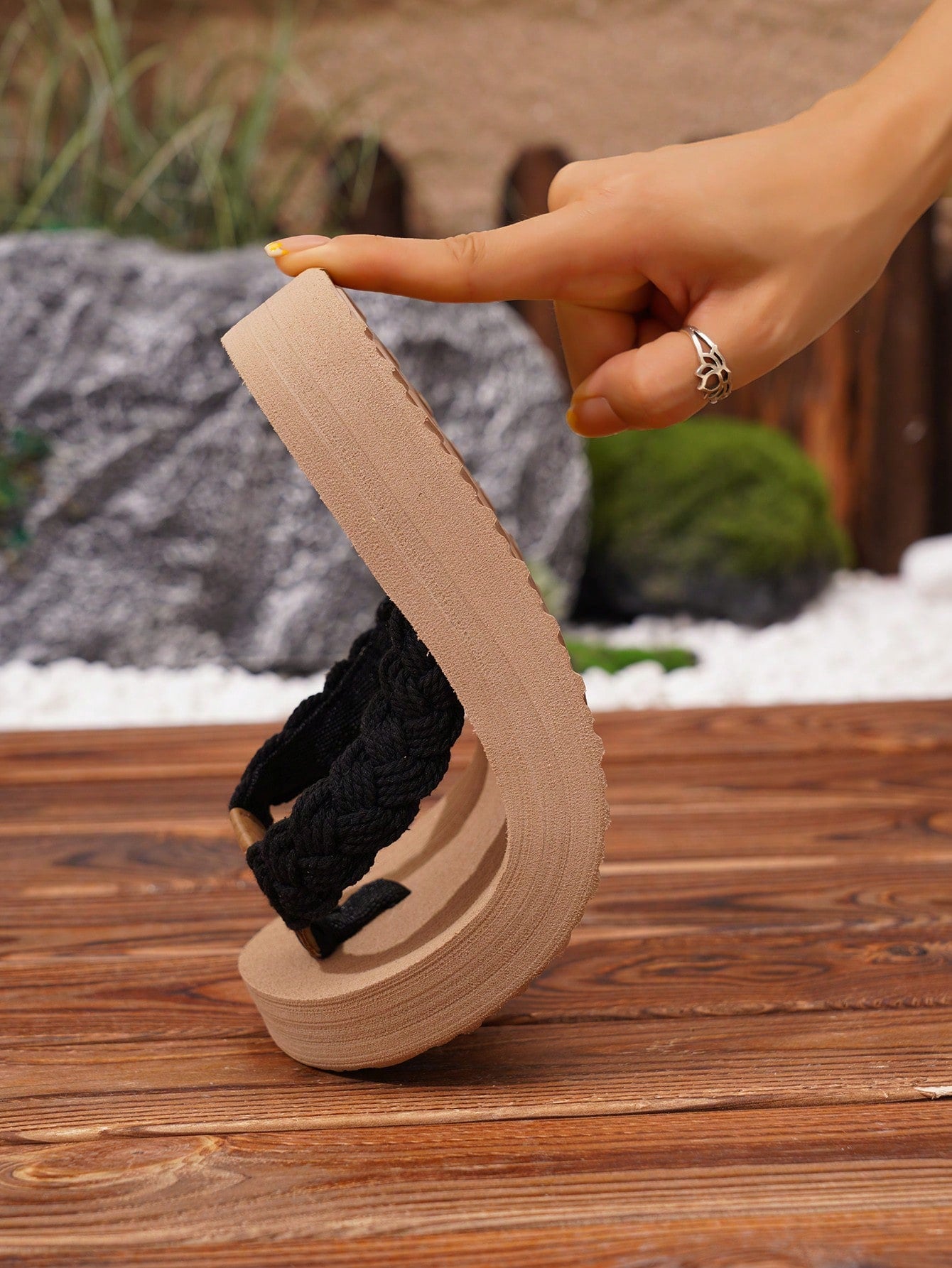 Women's black flip-flop slippers with a flat thick sole, fabric upper and lining, and insole and outsole for casual outdoor, street, beach, and vacation wear.