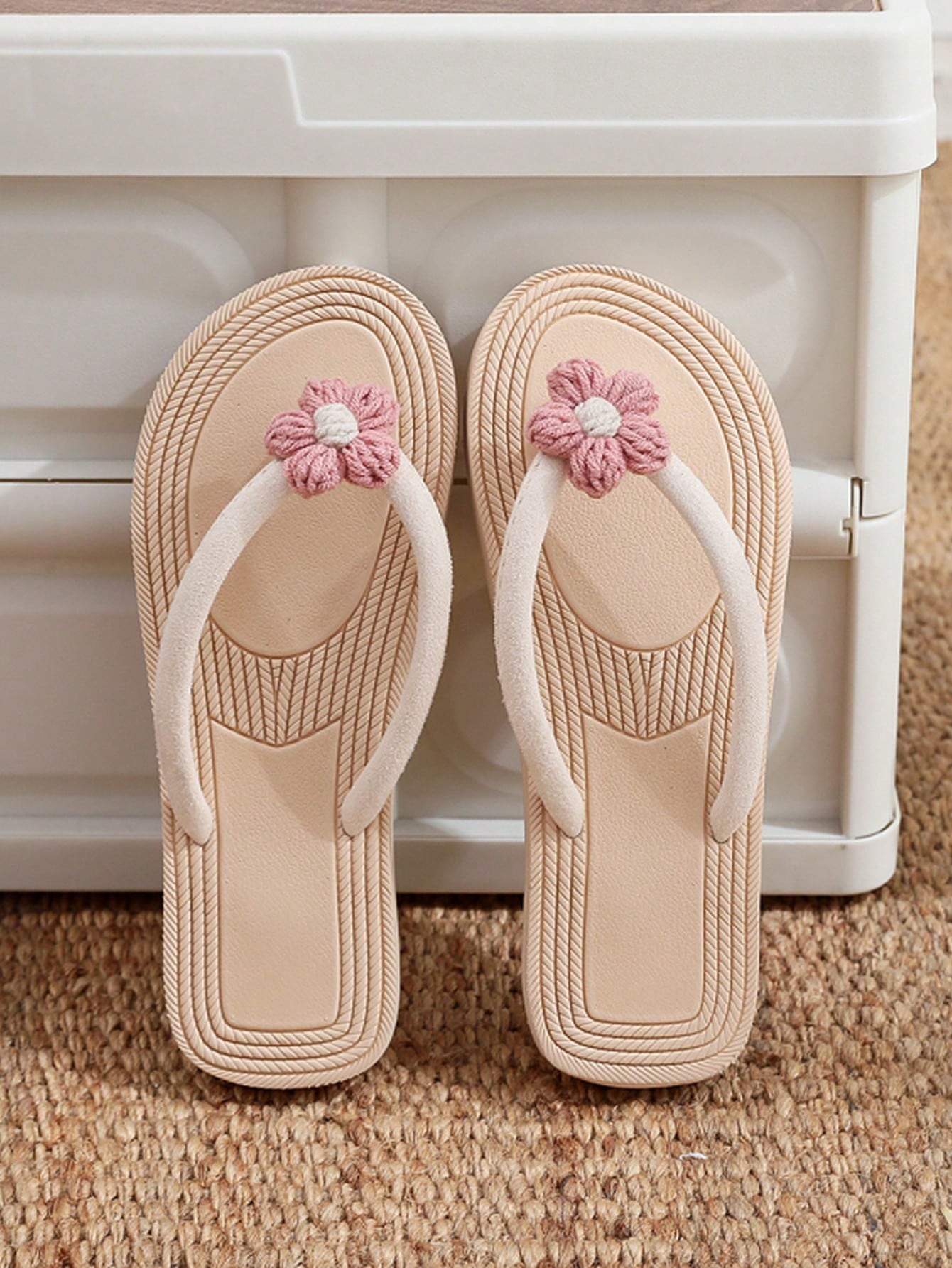 Women's casual flat thong flip flop sandals with minimalist design and applique detail, suitable for outdoor and beach holiday wear.