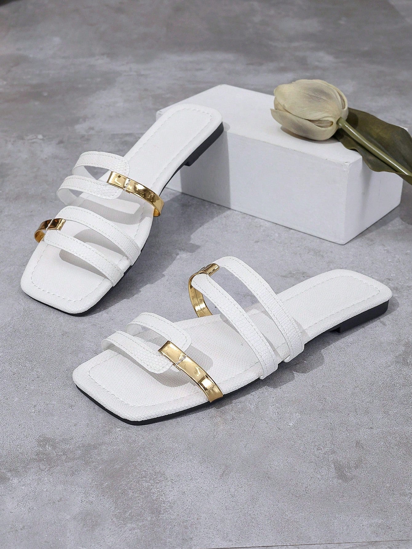 Women's yellow open-toe flat slide sandals featuring a cut-out design and textured plain pattern for casual beach and daily wear.