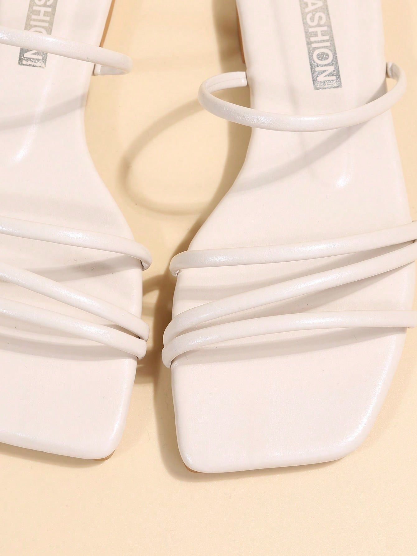 Casual striped flat slide sandals with beaded detail and open toe, beach-style slip-on design.