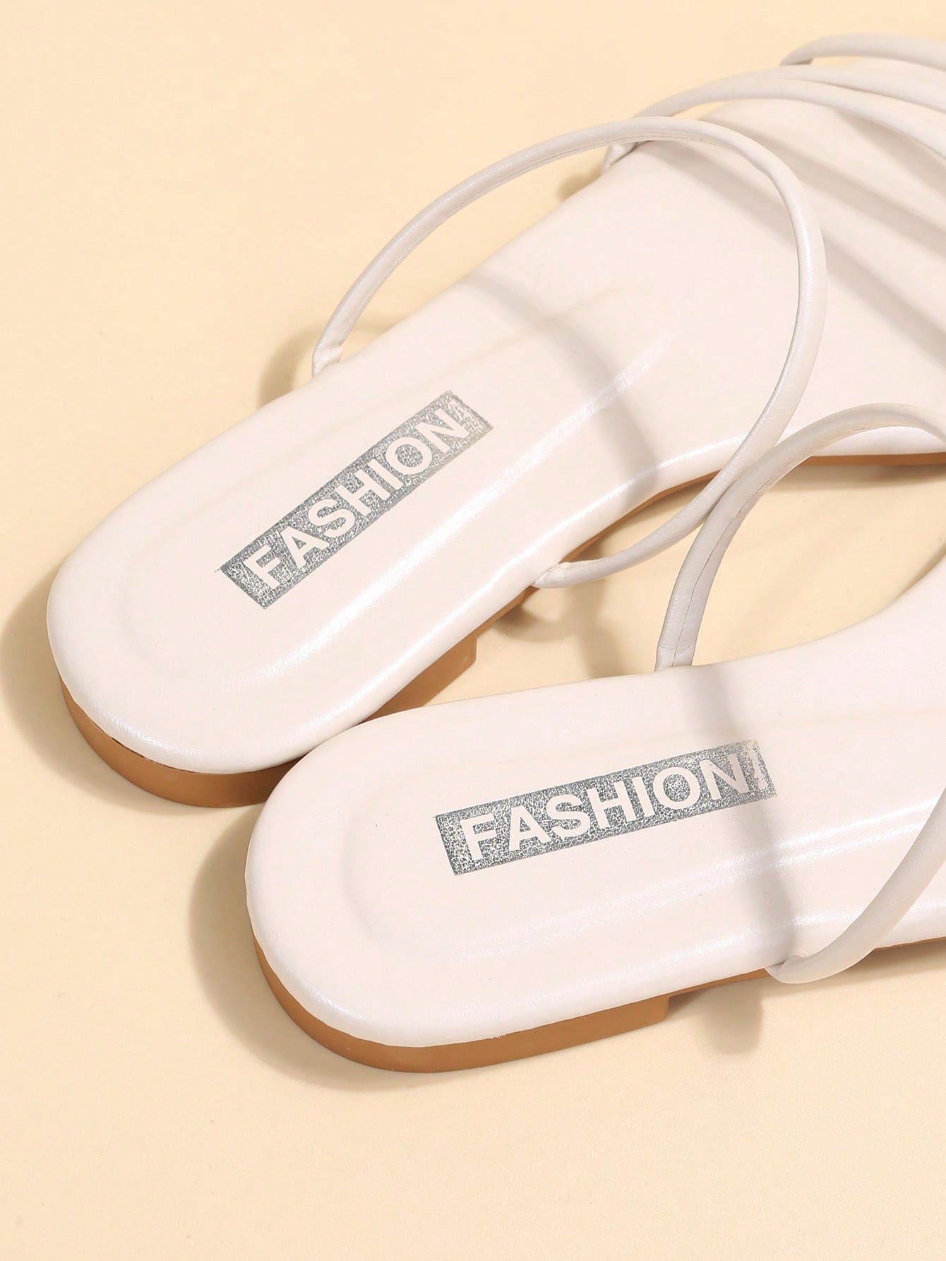 Casual striped flat slide sandals with beaded detail and open toe, beach-style slip-on design.