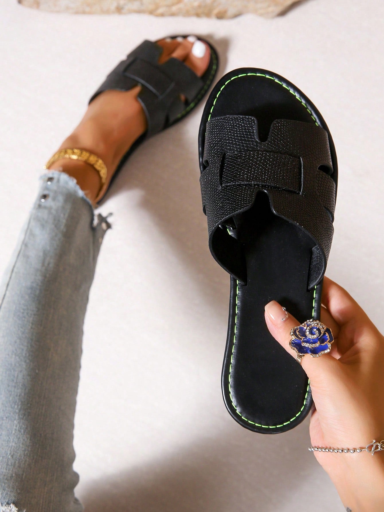 Women's open-toe flat slide sandals with slip-on design and metal decoration, suitable for outdoor casual summer wear.