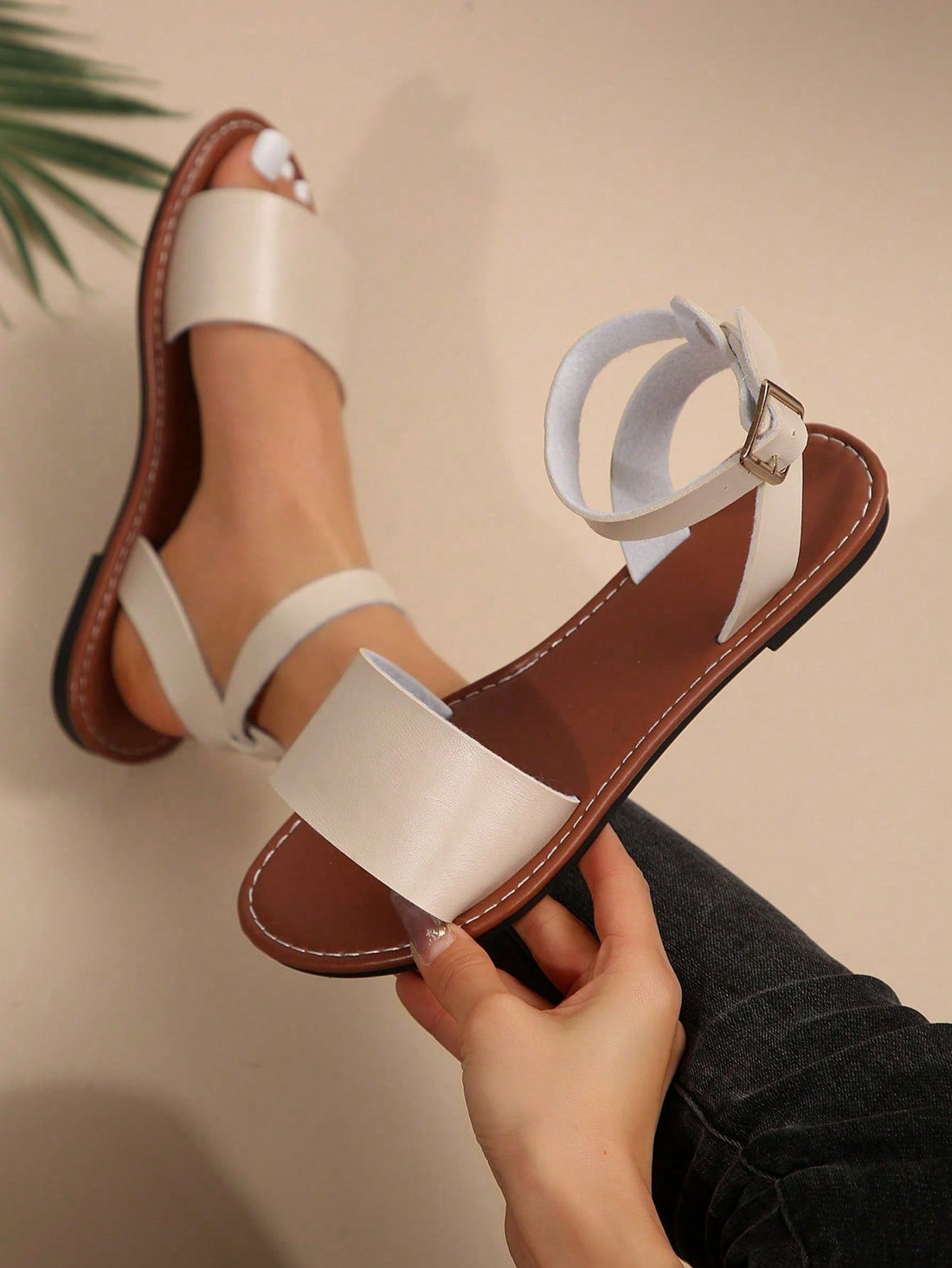 Plus size women’s slip-on flat slide sandals with a plain design, hollow out detail, and PU leather upper, suitable for casual outdoor and summer wear.