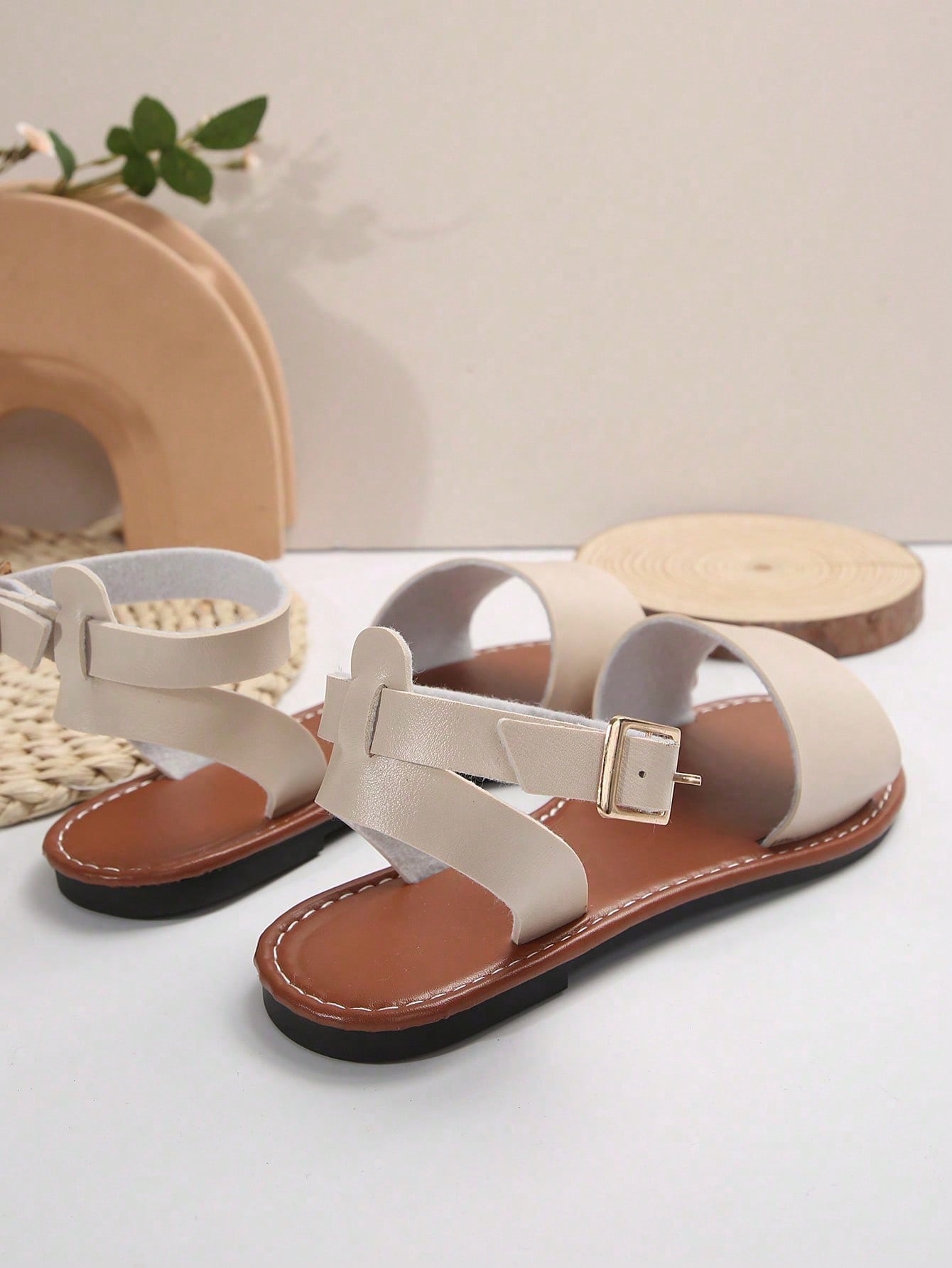 Plus size women’s slip-on flat slide sandals with a plain design, hollow out detail, and PU leather upper, suitable for casual outdoor and summer wear.