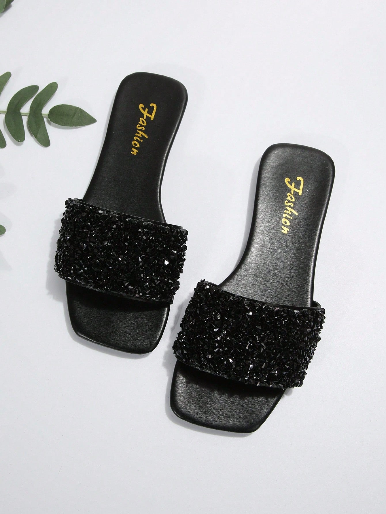 Black plus size women's slip-on flat slide sandals with square open toe, soft non-slip sole, and pearl rhinestone embellishments.