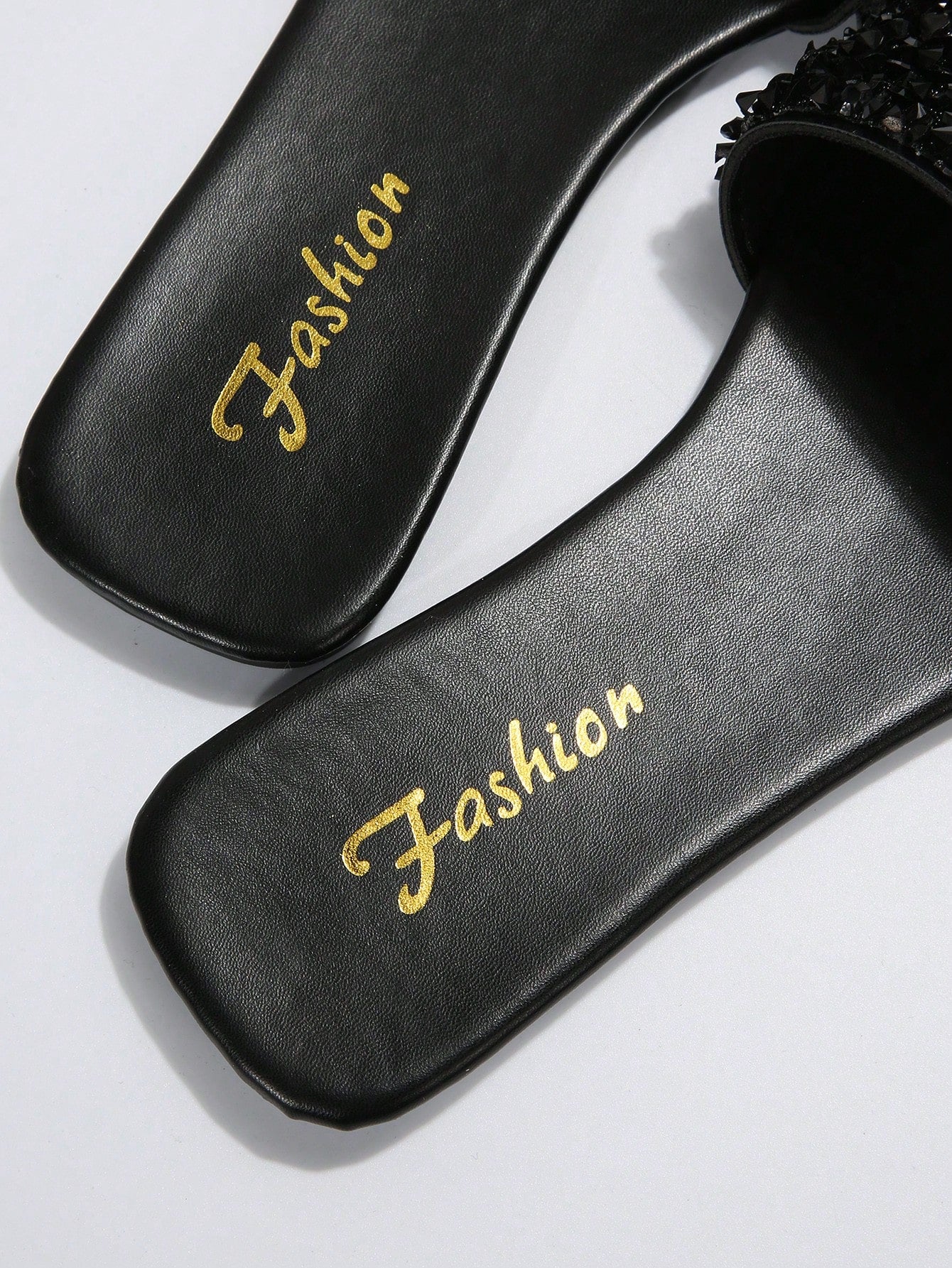 Black plus size women's slip-on flat slide sandals with square open toe, soft non-slip sole, and pearl rhinestone embellishments.