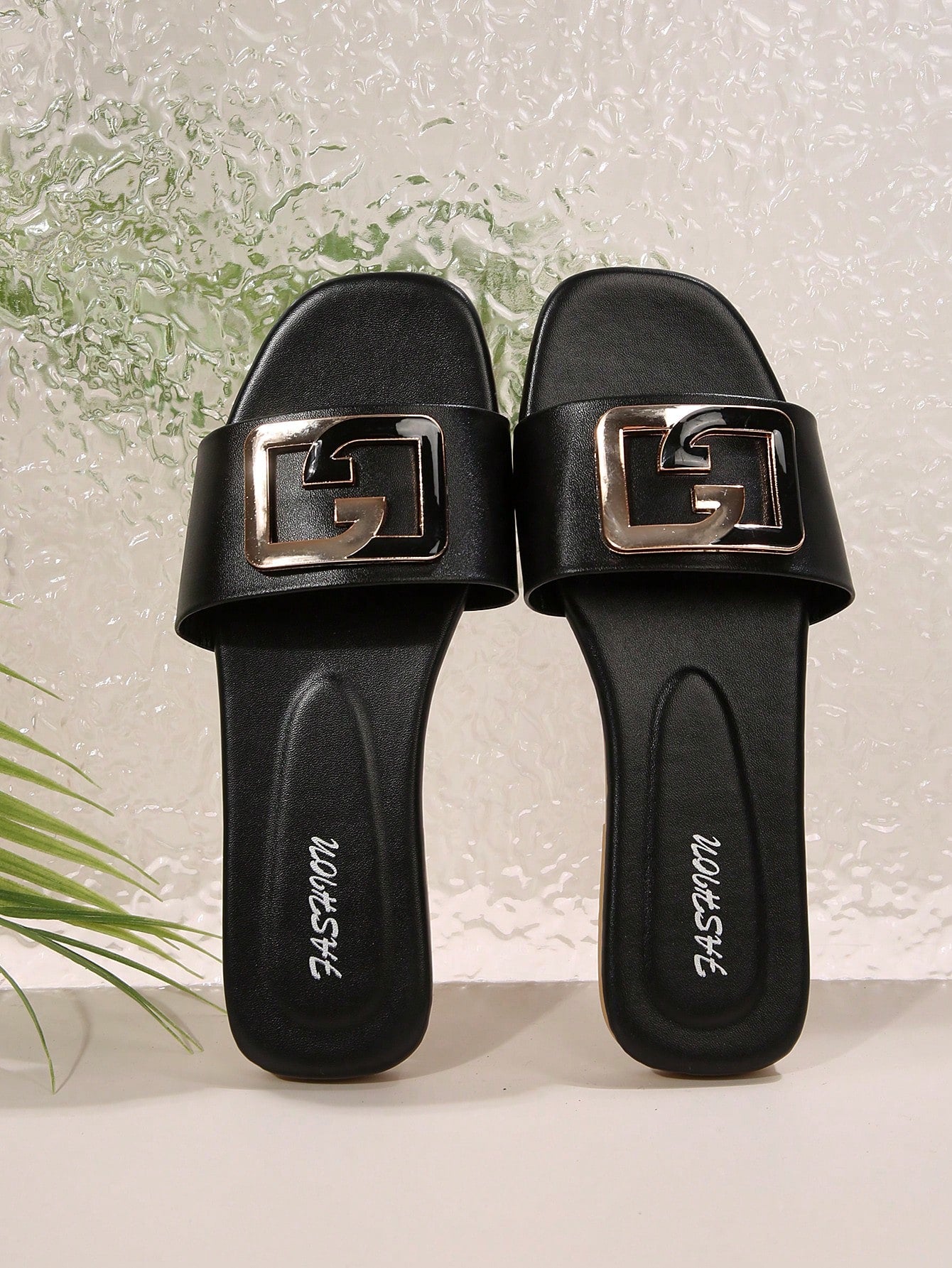Women's gold-tone slip-on slide sandals with open toe and chain link detailing, shown as casual flat sandals for indoor and outdoor use.