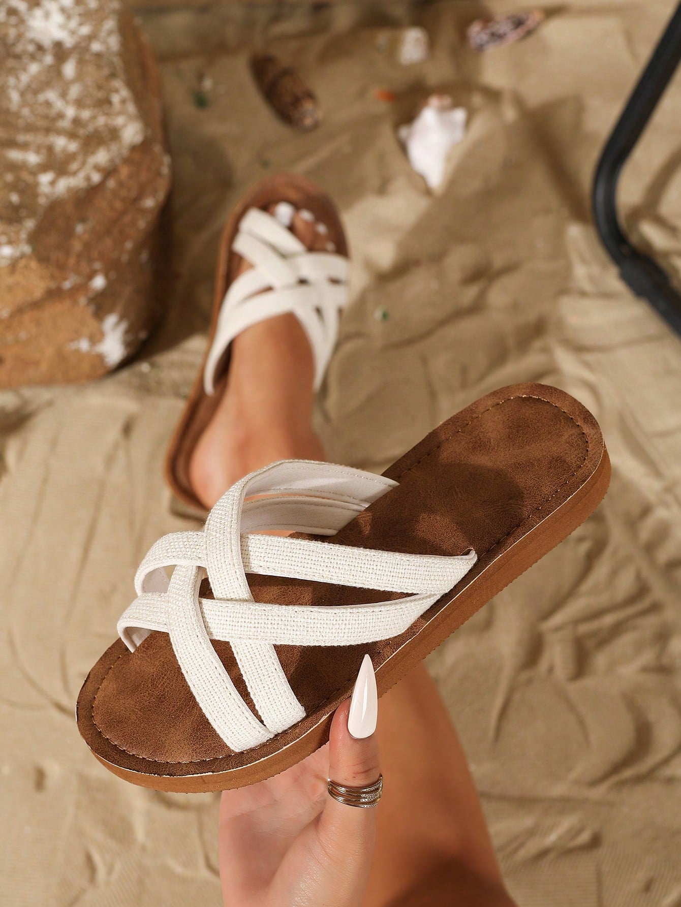 Women's flat lace slide sandals with an open-toe, hollow breathable upper and lightweight beach slipper design.