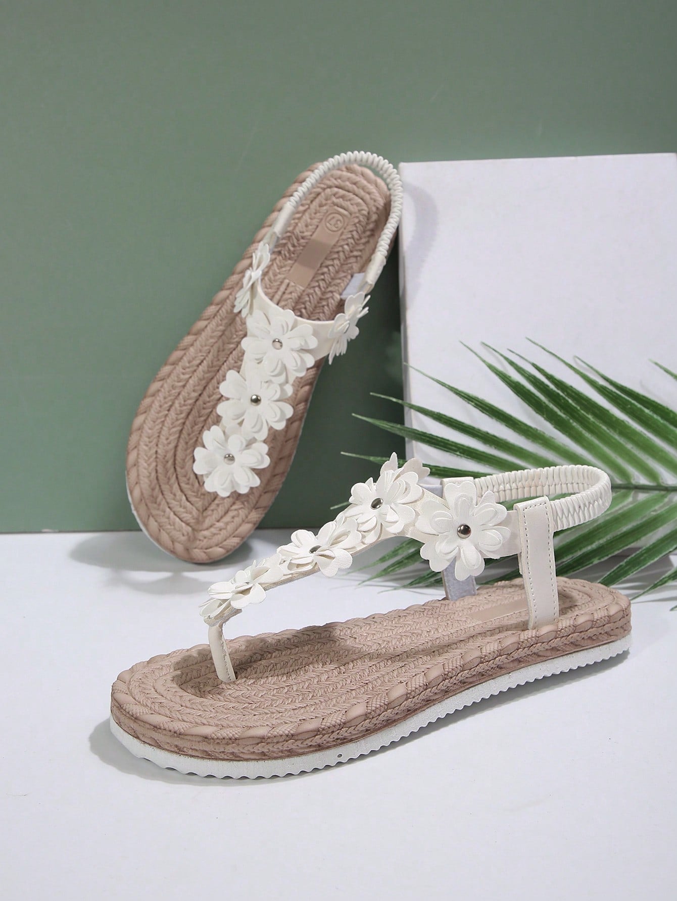 Women's white flat T-strap slip-on sandals with toe post and ditsy floral applique decoration