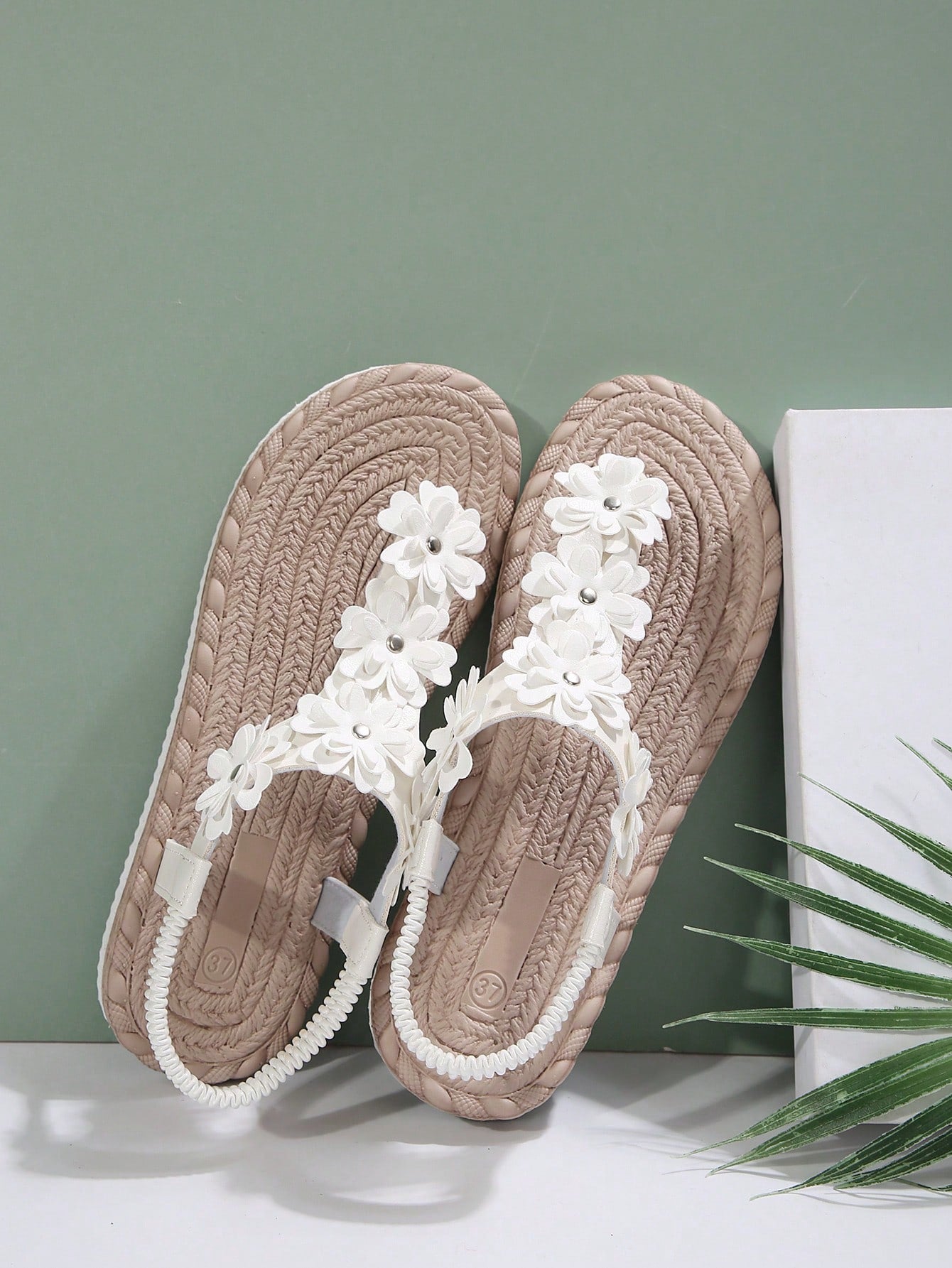Women's white flat T-strap slip-on sandals with toe post and ditsy floral applique decoration