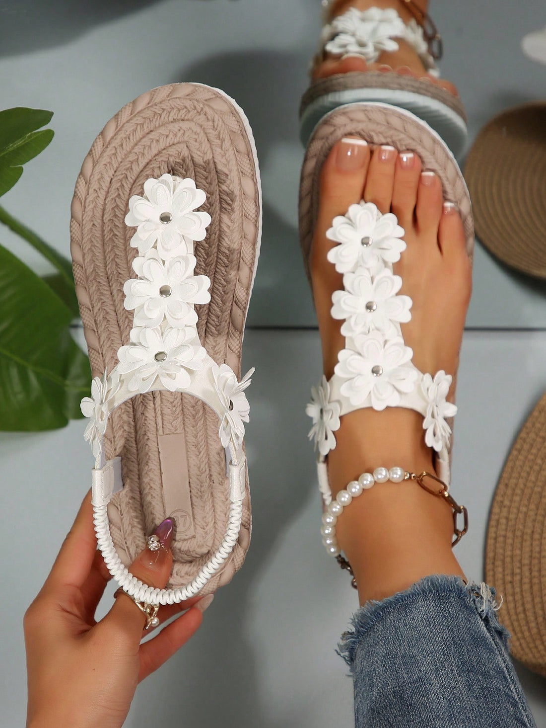 Women's white flat T-strap slip-on sandals with toe post and ditsy floral applique decoration