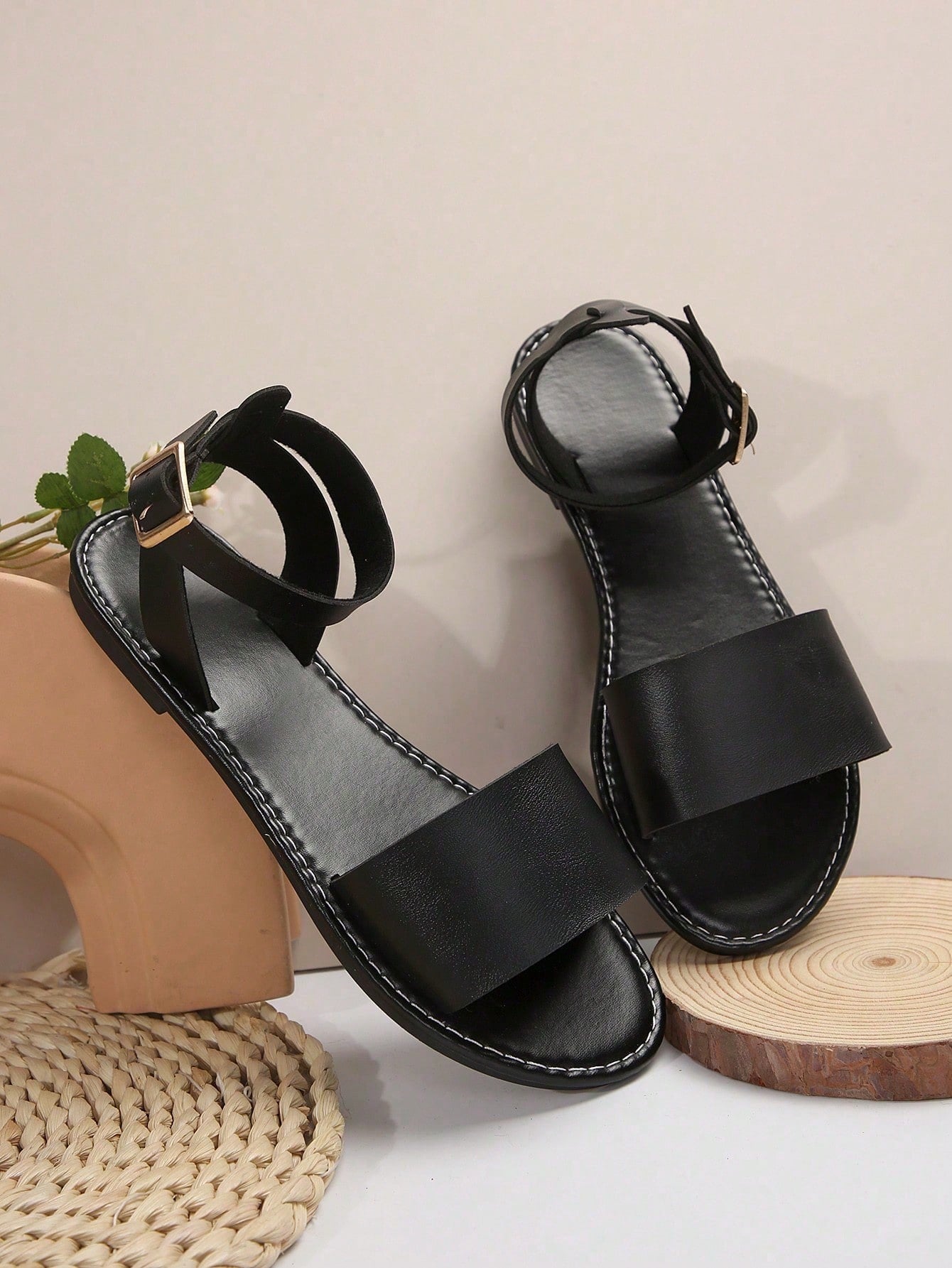 Plus size women’s slip-on flat slide sandals with a plain design, hollow out detail, and PU leather upper, suitable for casual outdoor and summer wear.