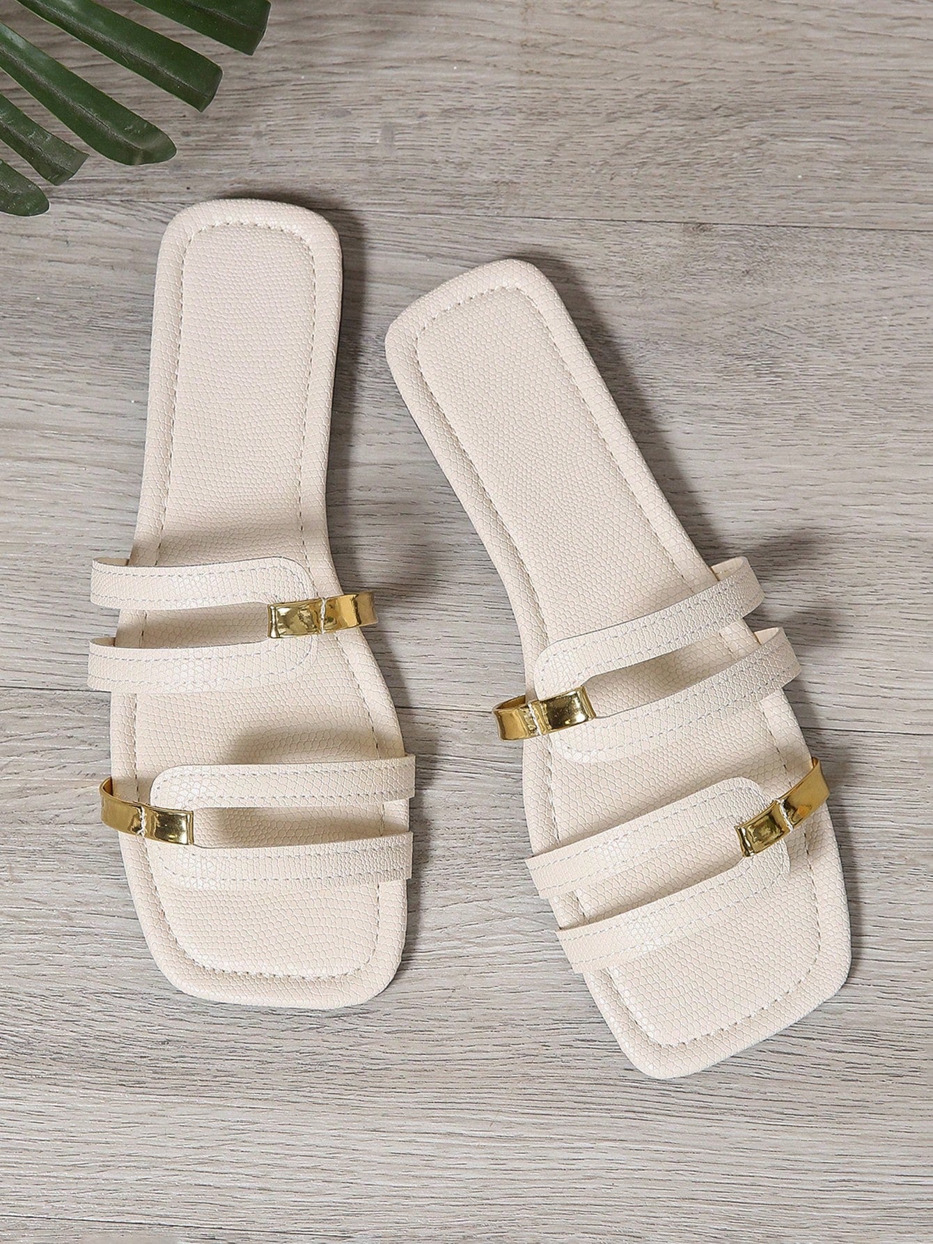 Women's yellow open-toe flat slide sandals featuring a cut-out design and textured plain pattern for casual beach and daily wear.