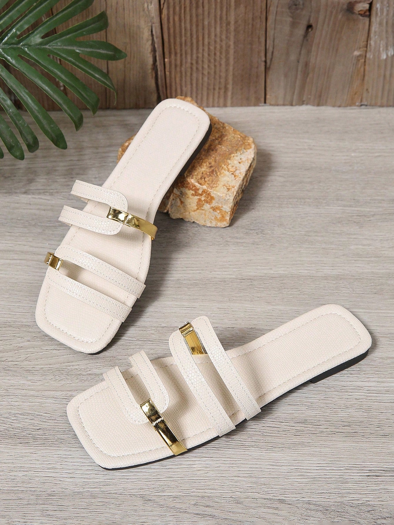 Women's yellow open-toe flat slide sandals featuring a cut-out design and textured plain pattern for casual beach and daily wear.