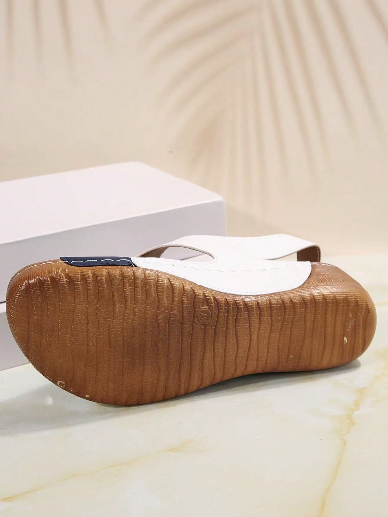 Women's color block platform flat sandals with open toe, criss-cross straps, and hook-loop closure, featuring a low heel thick sole design for casual vacation wear.