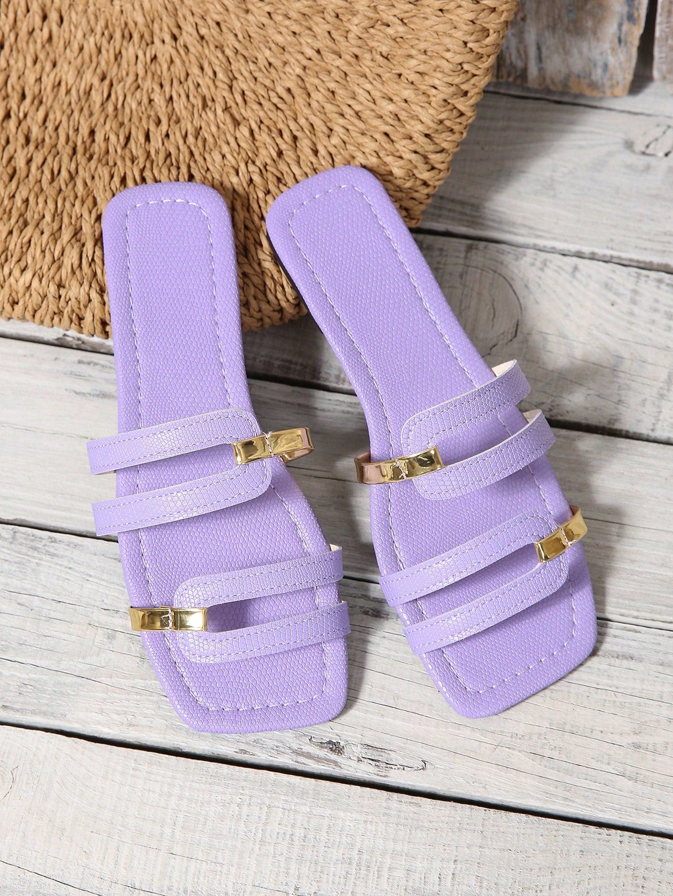 Women's yellow open-toe flat slide sandals featuring a cut-out design and textured plain pattern for casual beach and daily wear.