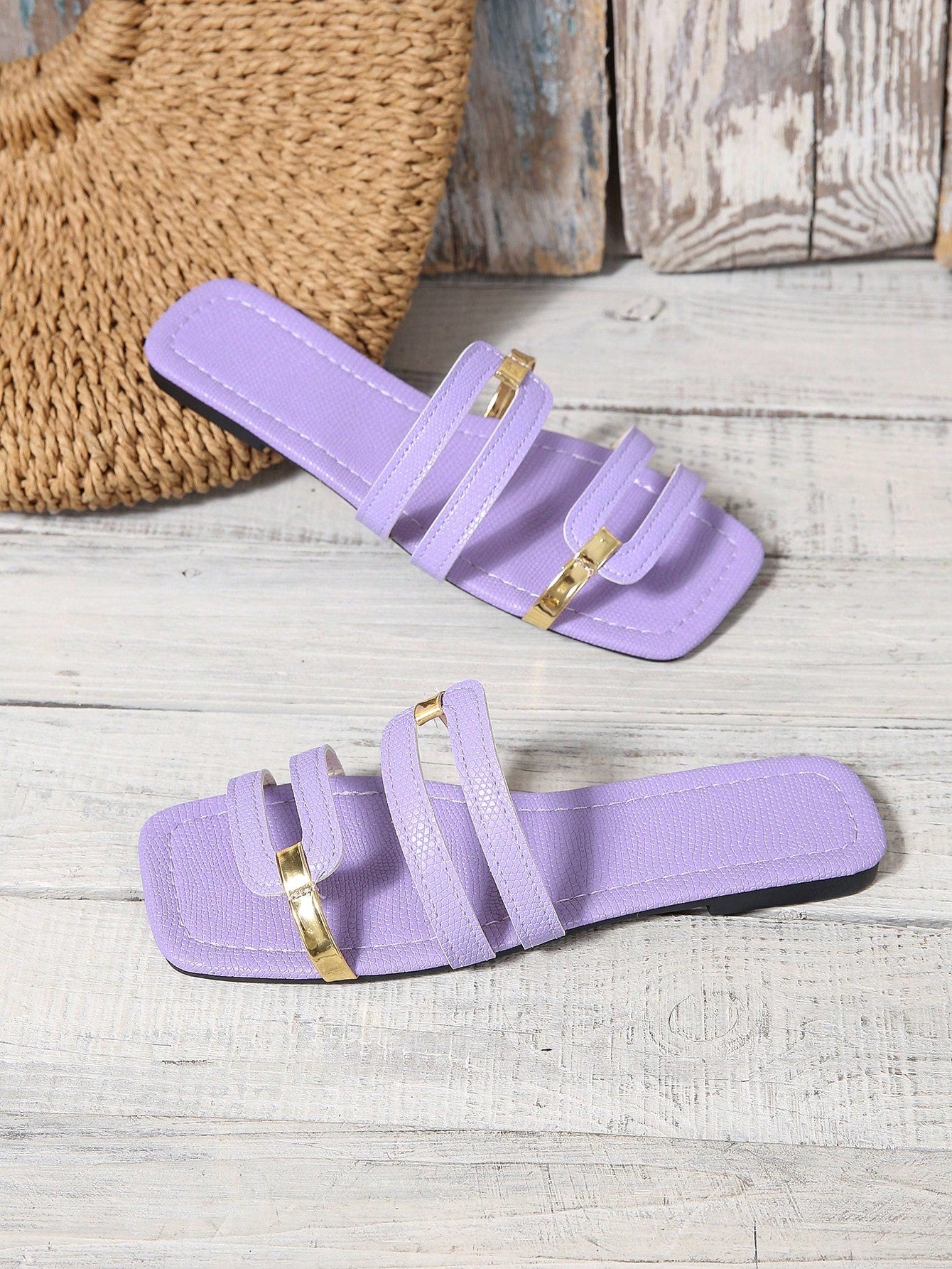 Women's yellow open-toe flat slide sandals featuring a cut-out design and textured plain pattern for casual beach and daily wear.