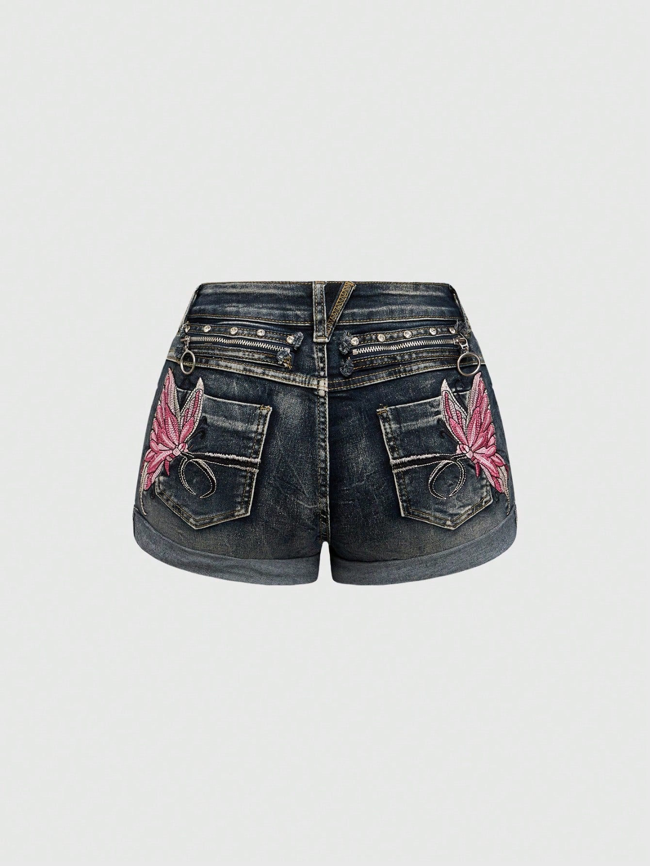 Blue washed shorts with butterfly embroidery, distressed detailing, ultra low waist, button closure, zipper fly, and pockets.