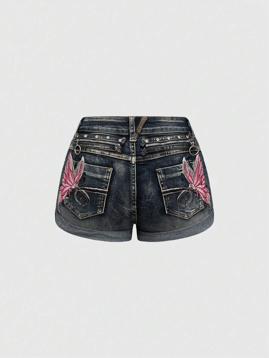 Blue washed shorts with butterfly embroidery, distressed detailing, ultra low waist, button closure, zipper fly, and pockets.
