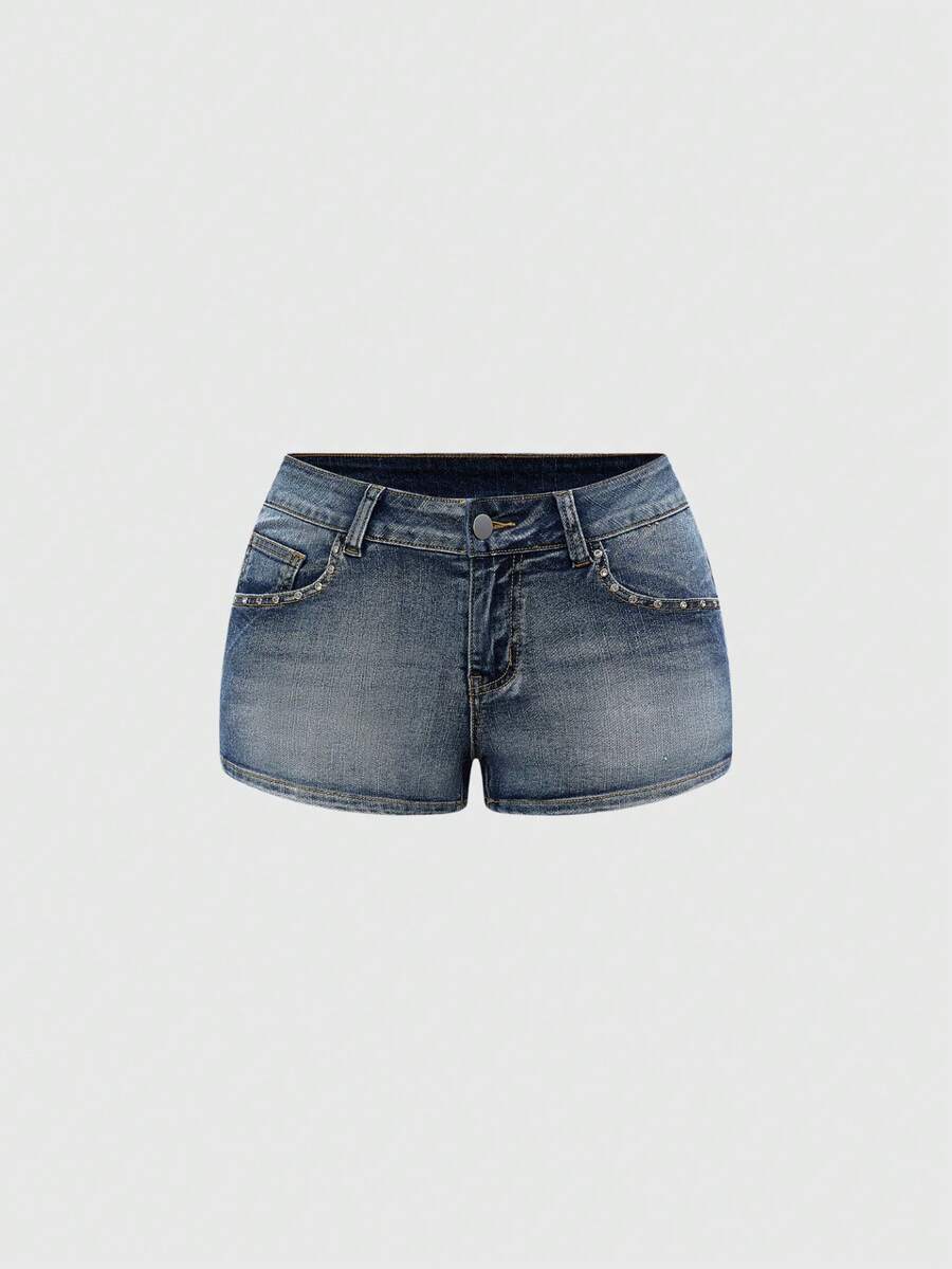 Blue ultra low waist mini shorts with ripped details, zipper fly, button closure, back wing embroidery, and rhinestone decor in a Y2K grunge punk style.