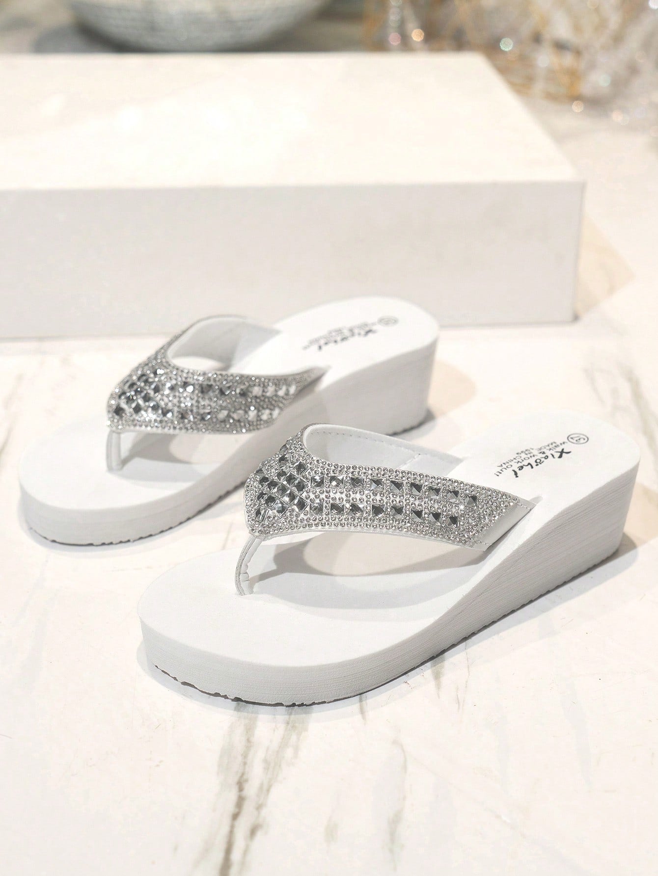 Women's pearl decor thong sandals with rhinestone embellishments, strappy slip-on design, and wedge heel, suitable for beach and wedding wear.