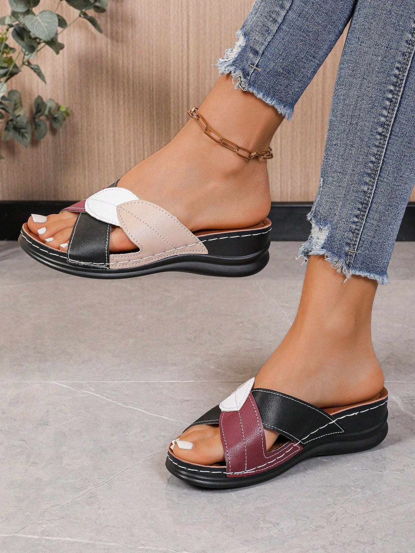 Women's multicolor wedge slide sandals with open toe, criss-cross straps, cut-out details, slip-on closure, and mid chunky wedge heel.