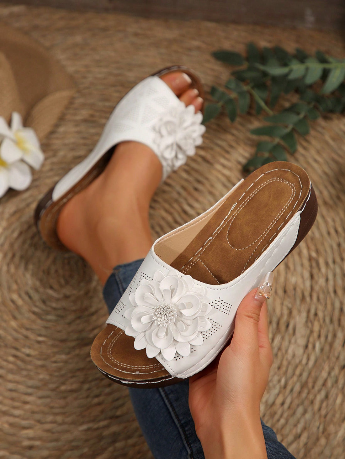 Women's white platform wedge slip-on sandals with open toe, thick sole, floral embroidery decor, and hollow-out upper detail.