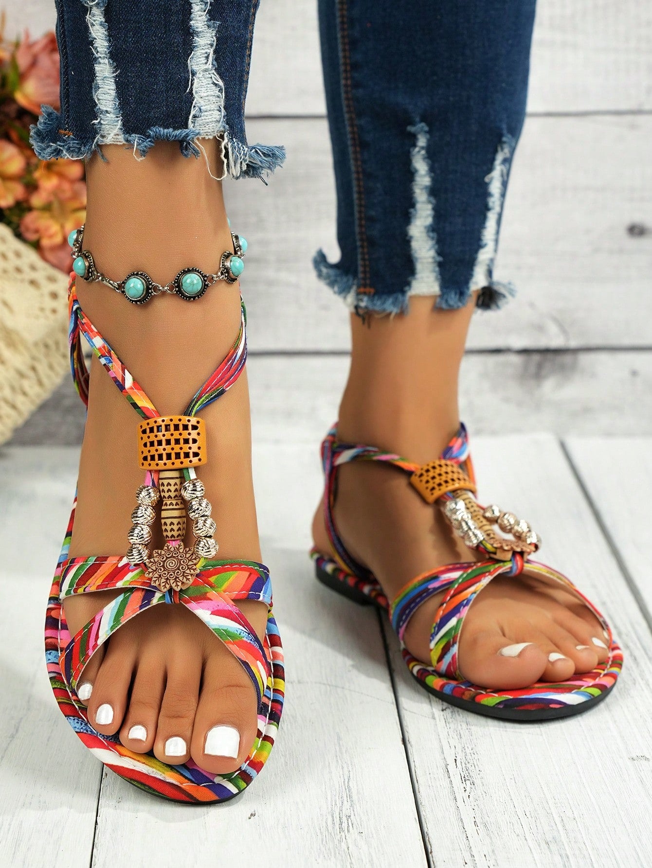 Women's beaded boho flat strappy sandals with open toe and tropical-inspired plain pattern, designed for beach and casual summer wear.