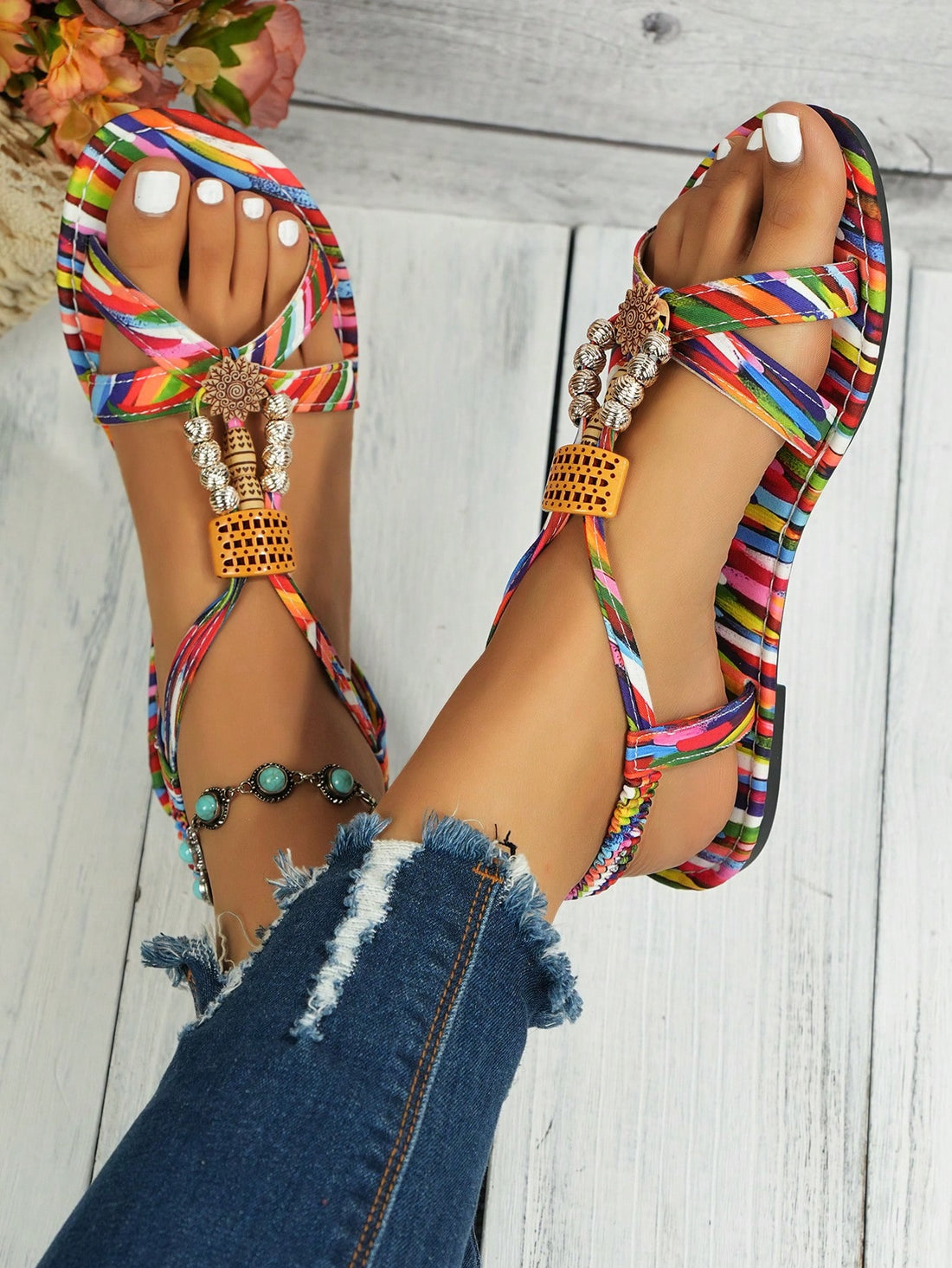 Women's beaded boho flat strappy sandals with open toe and tropical-inspired plain pattern, designed for beach and casual summer wear.
