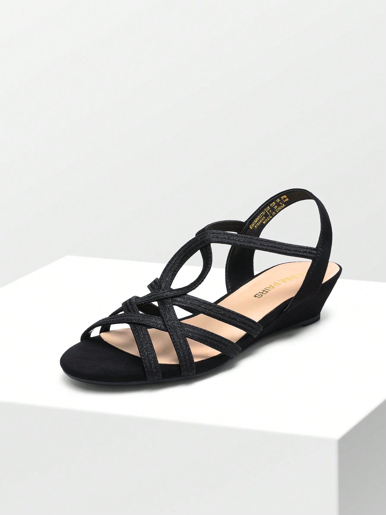 Women's open-toe low wedge sandals featuring crisscross straps, slingback ankle strap, and a classic wedge heel for dressy and everyday summer outfits.