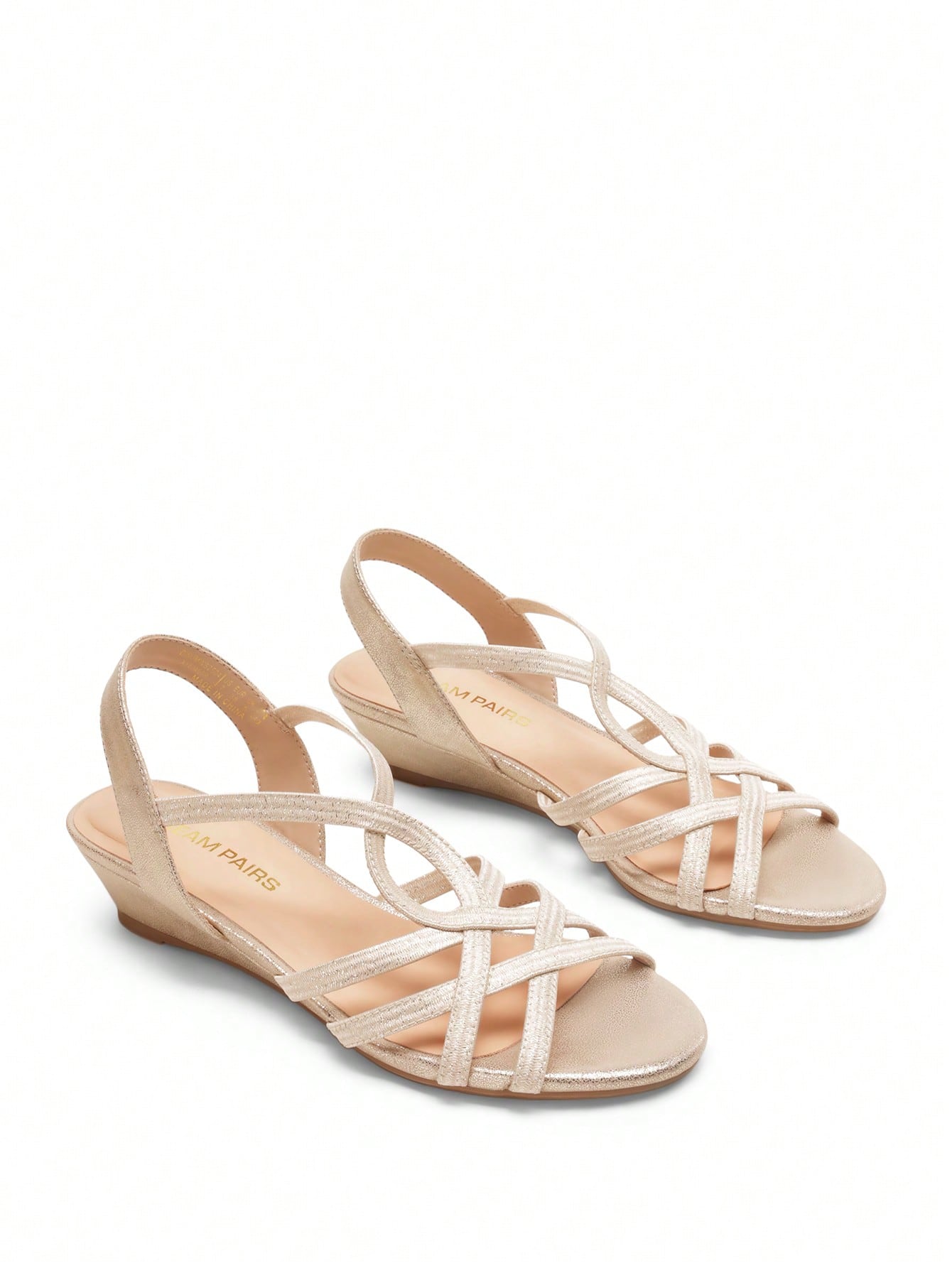 Women's open-toe low wedge sandals featuring crisscross straps, slingback ankle strap, and a classic wedge heel for dressy and everyday summer outfits.