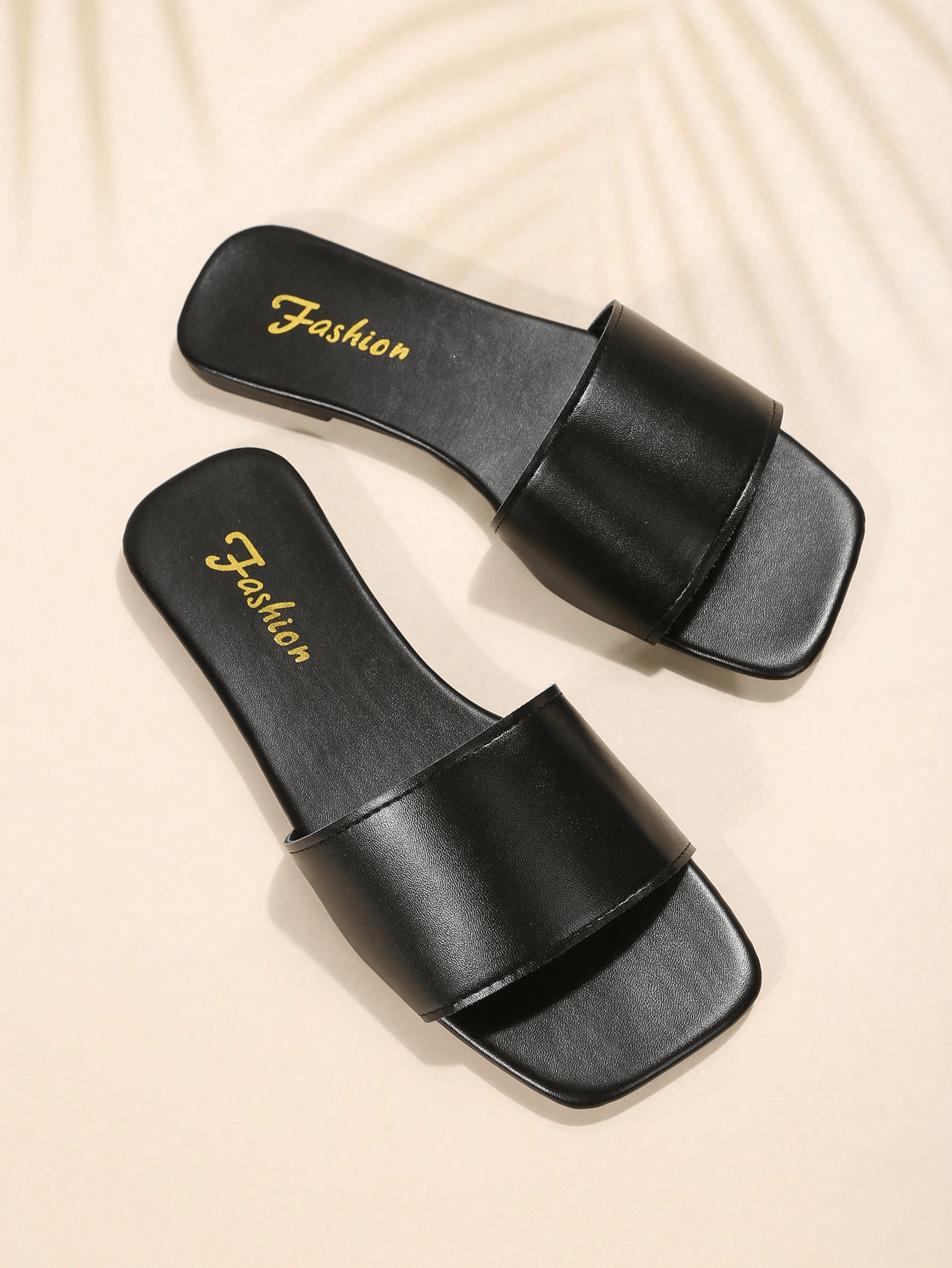 Women's flat slide sandals with a minimalist strap design, square open toe, and slip-on style for casual indoor and outdoor wear.