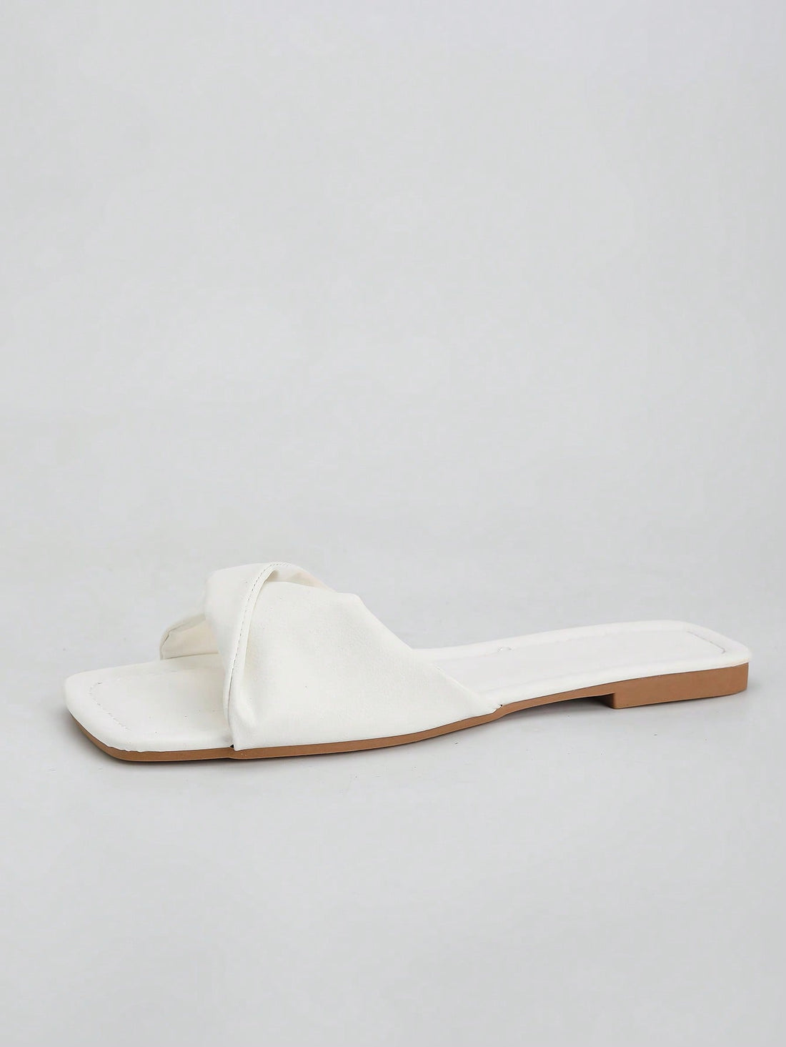 Women's white flat thong slide sandals with open square toe and twist detail, casual elegant style for home wear.