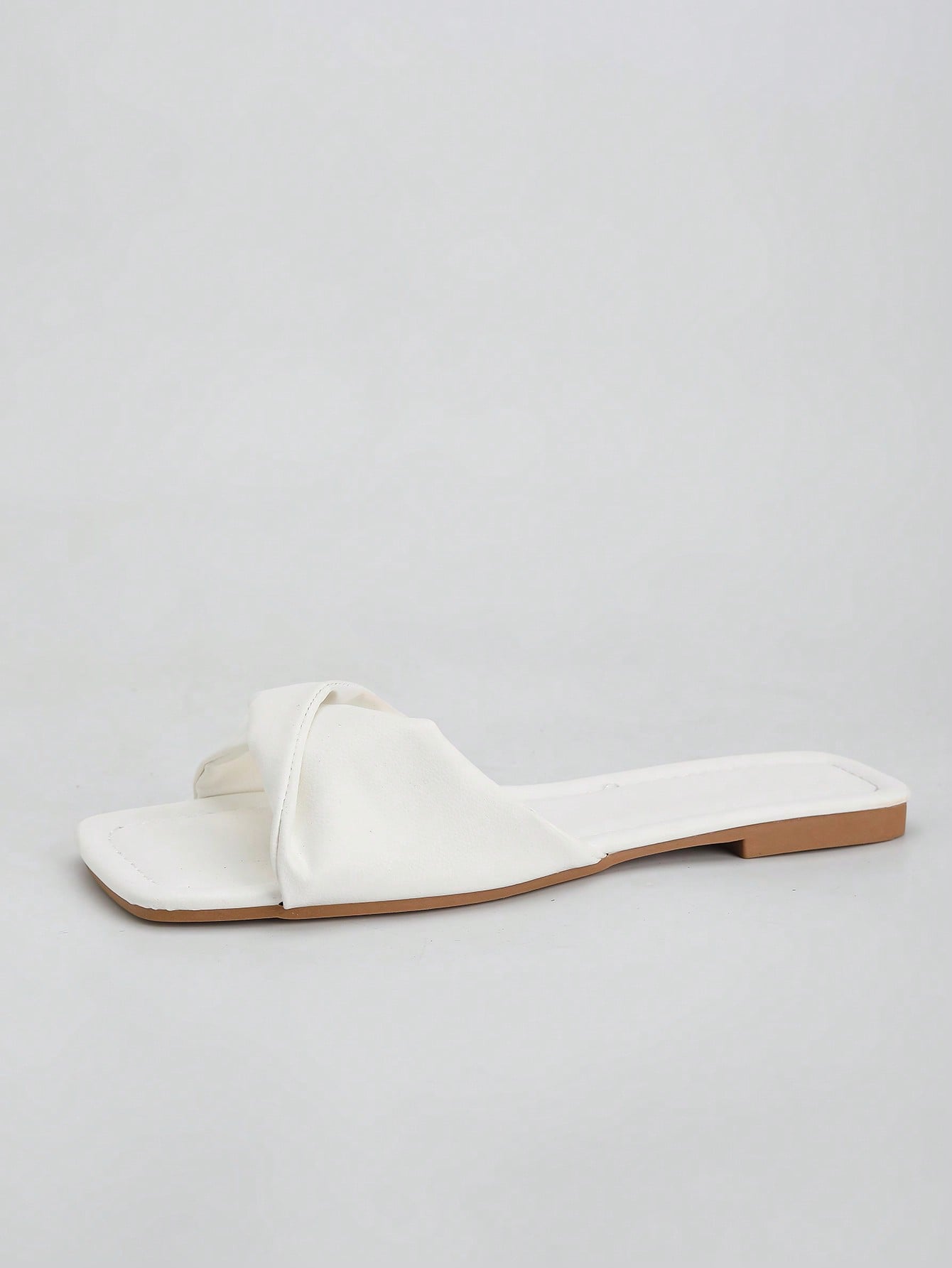 Women's white flat thong slide sandals with open square toe and twist detail, casual elegant style for home wear.