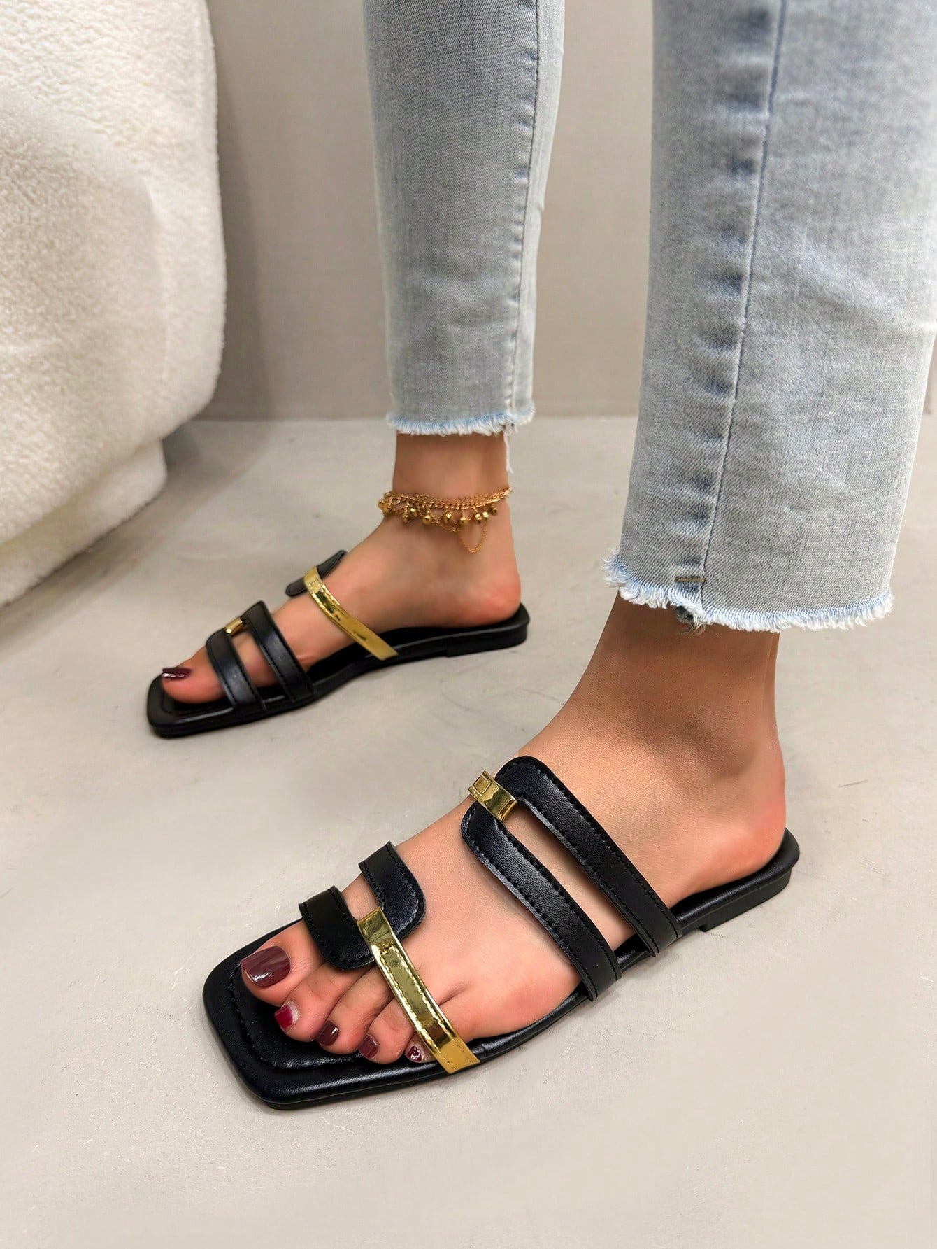 Women's flat slide sandals with open square toe and cut-out design in black, casual bohemian style for outdoor walking and beach wear.