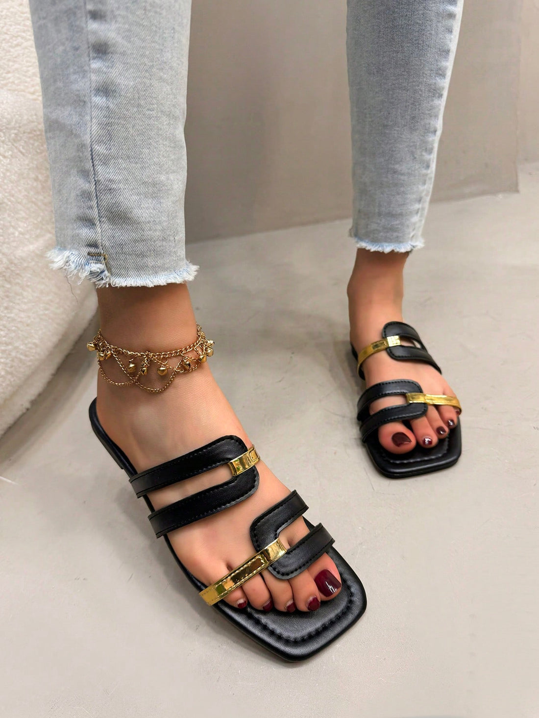 Women's flat slide sandals with open square toe and cut-out design in black, casual bohemian style for outdoor walking and beach wear.