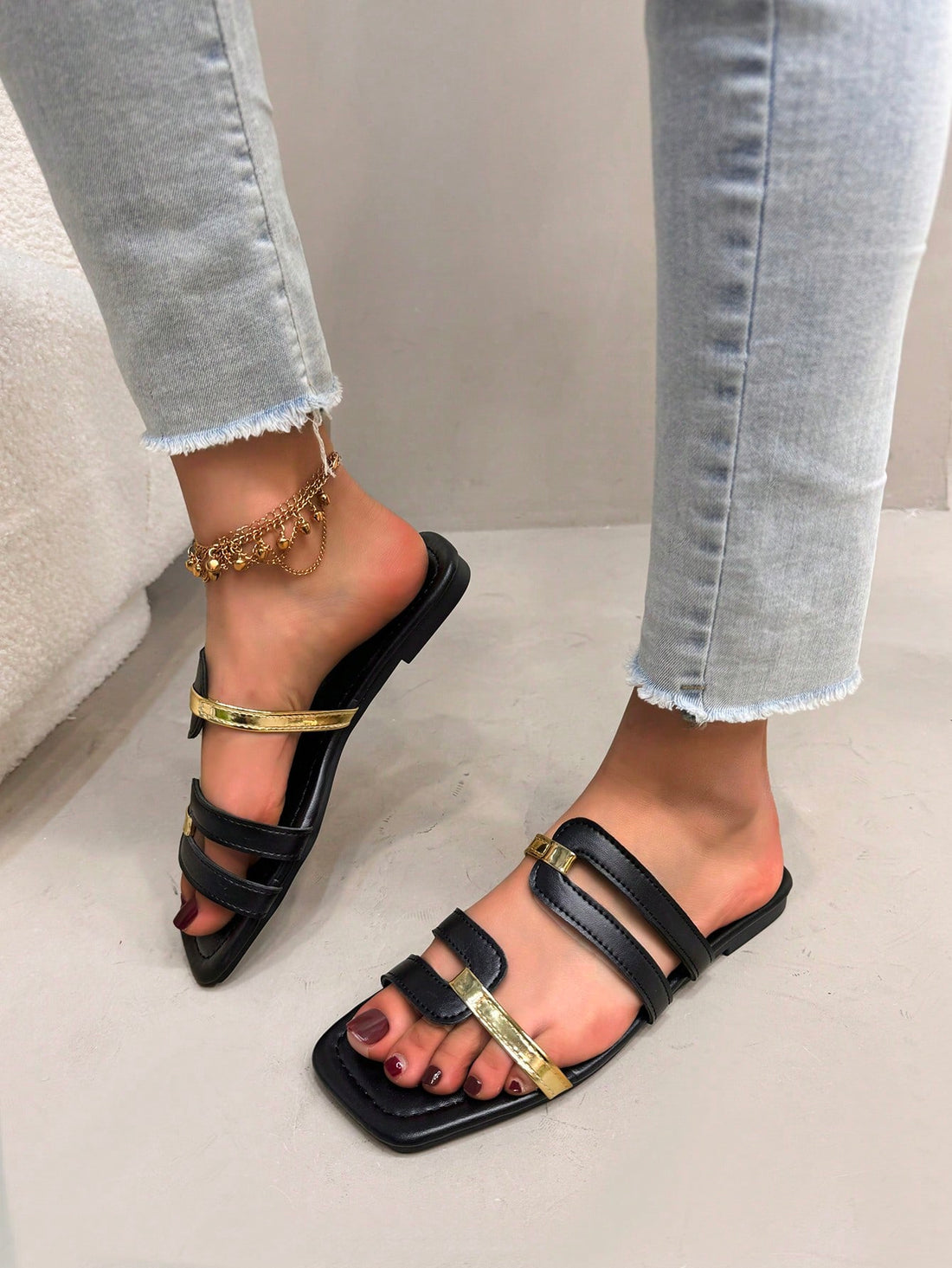 Women's flat slide sandals with open square toe and cut-out design in black, casual bohemian style for outdoor walking and beach wear.