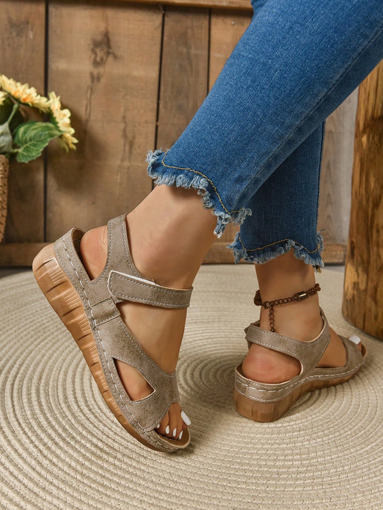 Women's platform sandals with hook-and-loop straps, crisscross upper detail, open toe, and chunky heel.